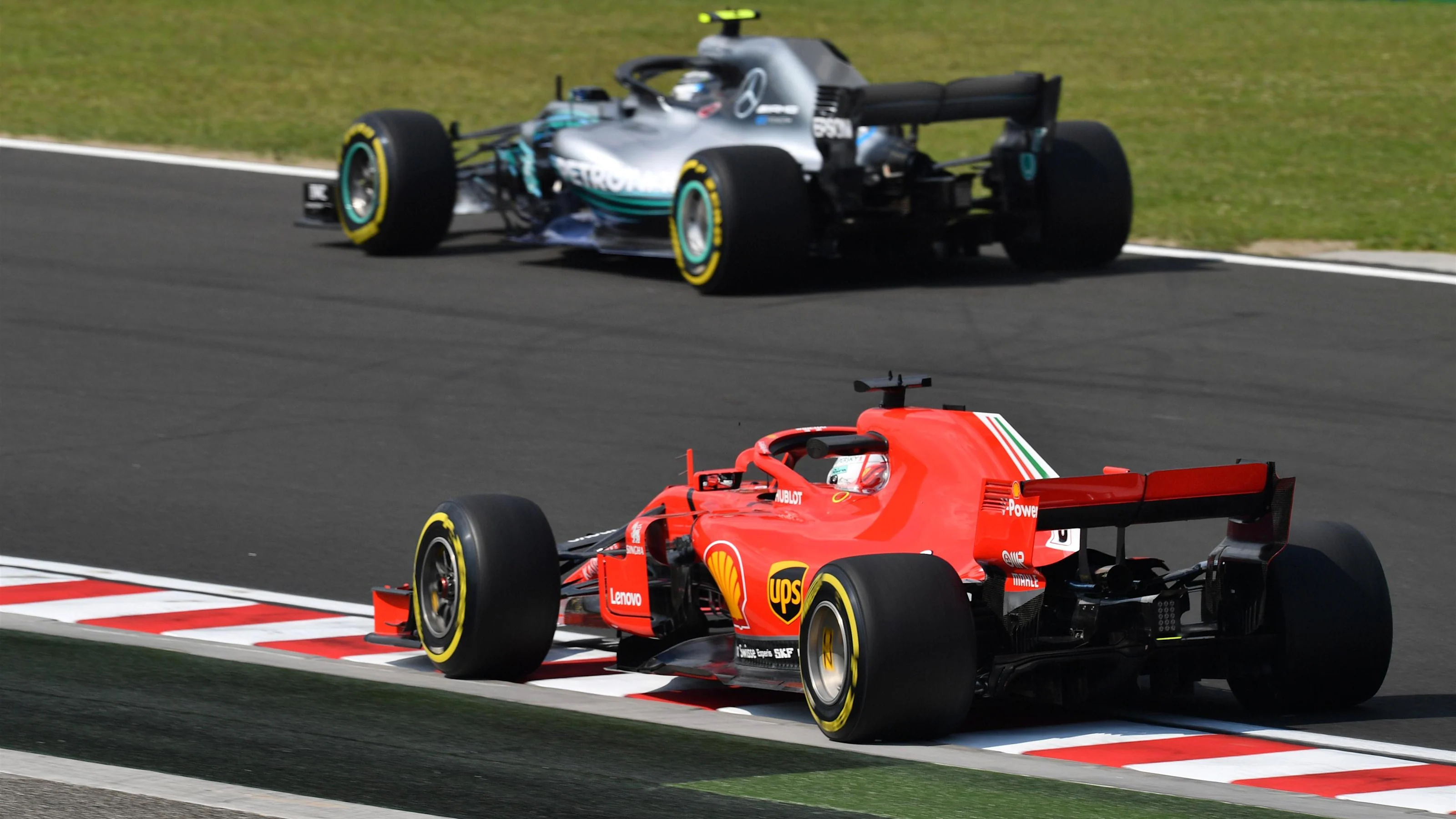 Sebastian Vettel (GER) Ferrari SF-71H and Valtteri Bottas (FIN) Mercedes-AMG F1 W09 EQ Power+ at