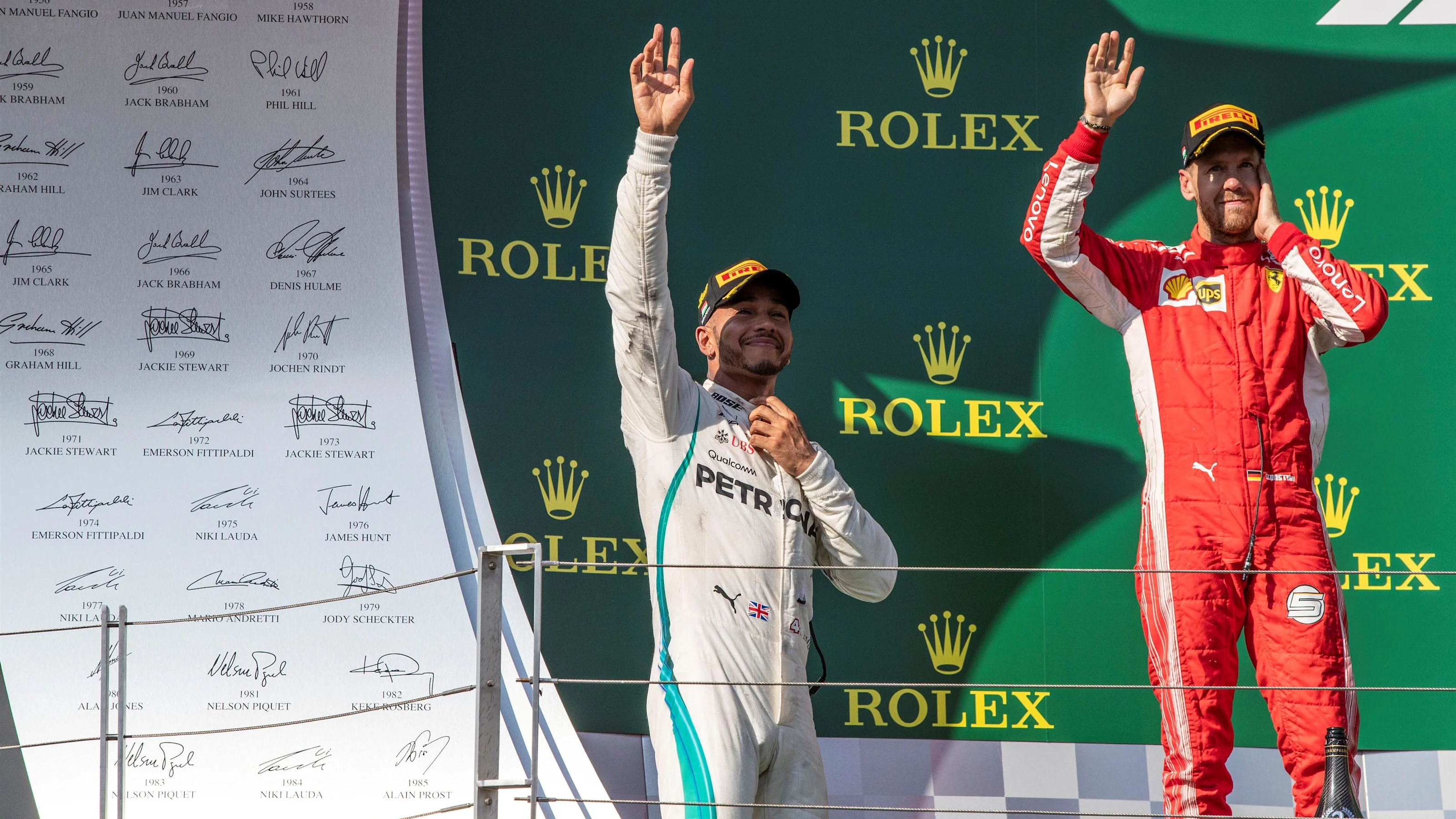 Lewis Hamilton (GBR) Mercedes-AMG F1 and Sebastian Vettel (GER) Ferrari celebrate on the podium at