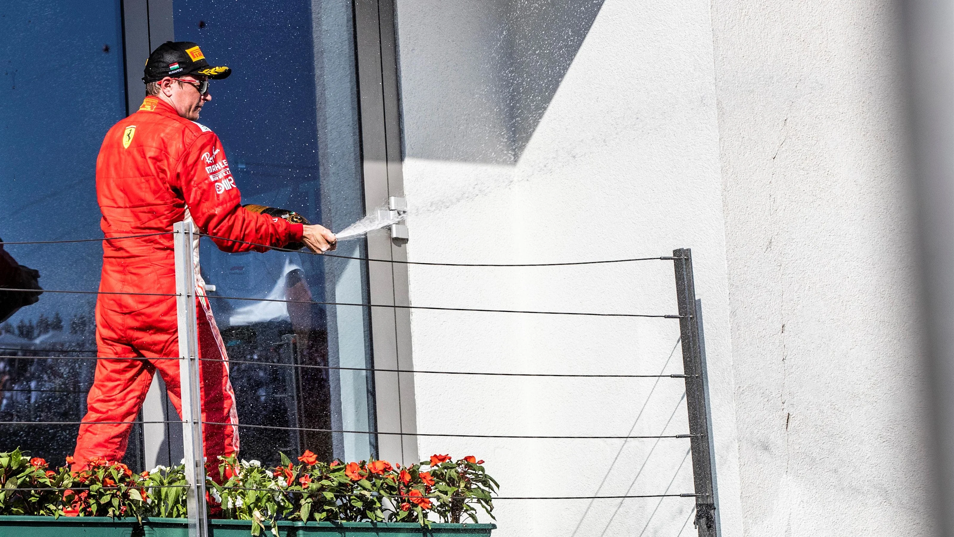 Kimi Raikkonen (FIN) Ferrari celebrates on the podium with the champagne at Formula One World
