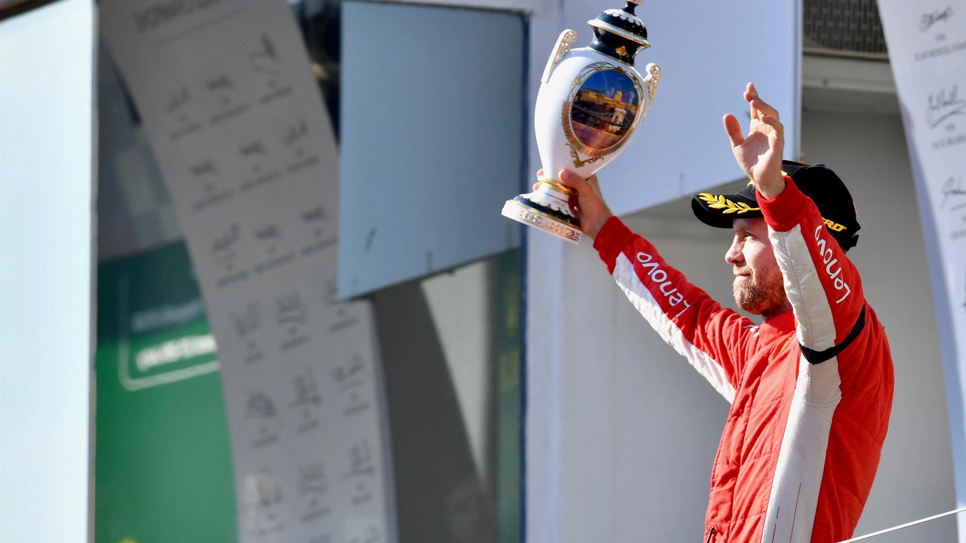 Sebastian Vettel (GER) Ferrari celebrates with the trophy on the podium at Formula One World