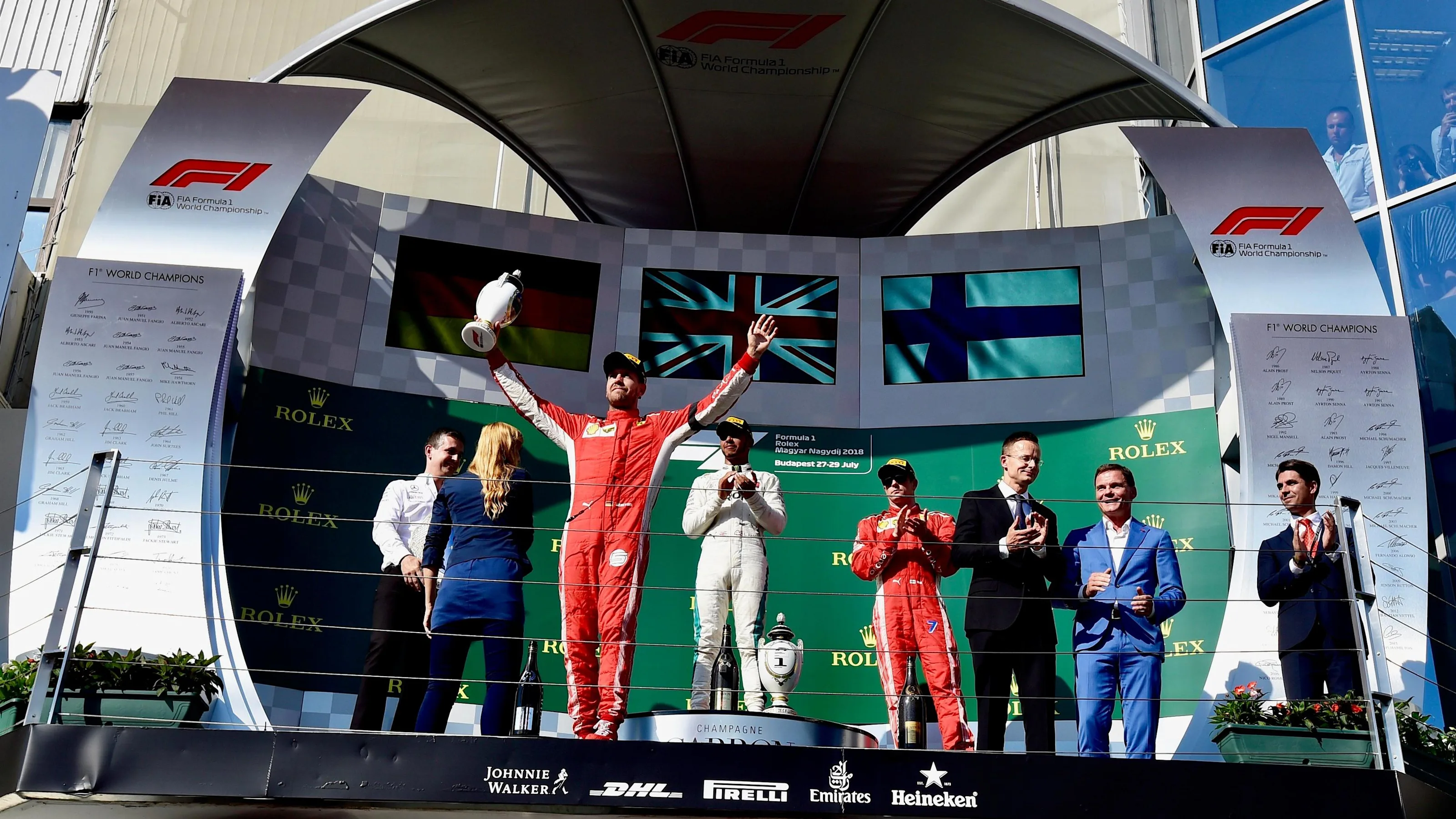 Sebastian Vettel (GER) Ferrari, Lewis Hamilton (GBR) Mercedes-AMG F1 and Kimi Raikkonen (FIN)