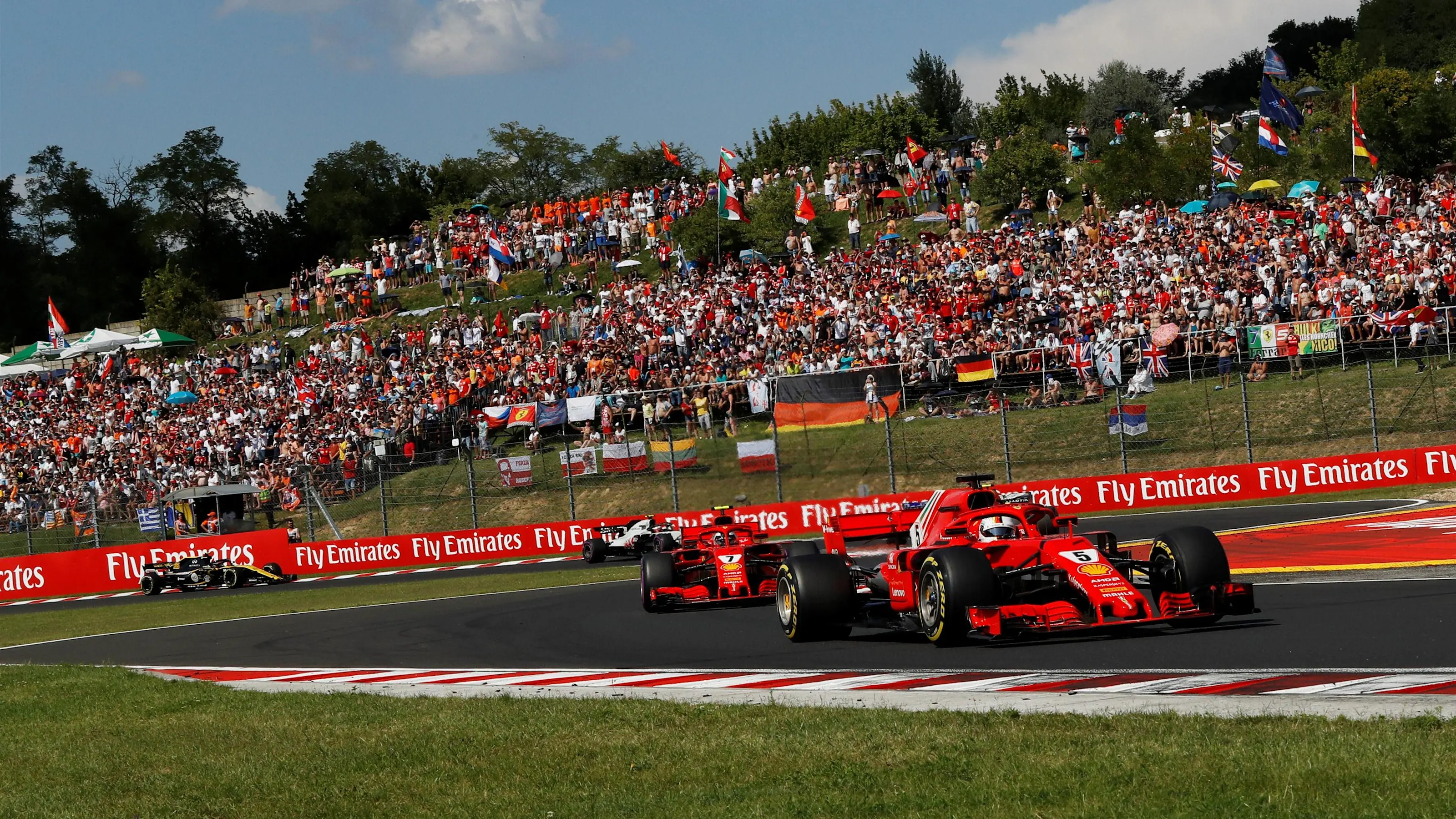 Sebastian Vettel (GER) Ferrari SF-71H leads Kimi Raikkonen (FIN) Ferrari SF-71H at Formula One