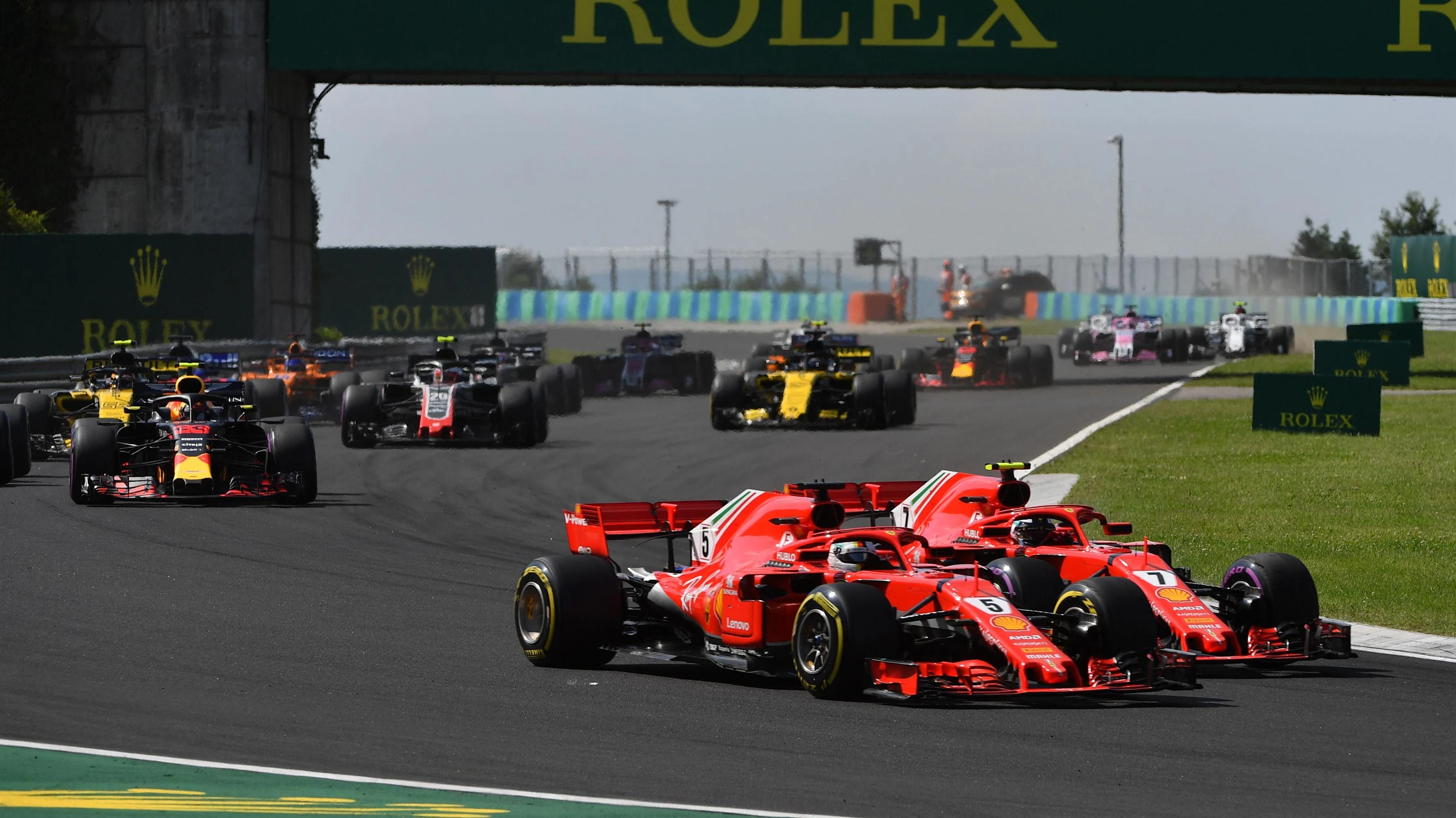Sebastian Vettel (GER) Ferrari SF-71H and Kimi Raikkonen (FIN) Ferrari SF-71H battle at Formula One