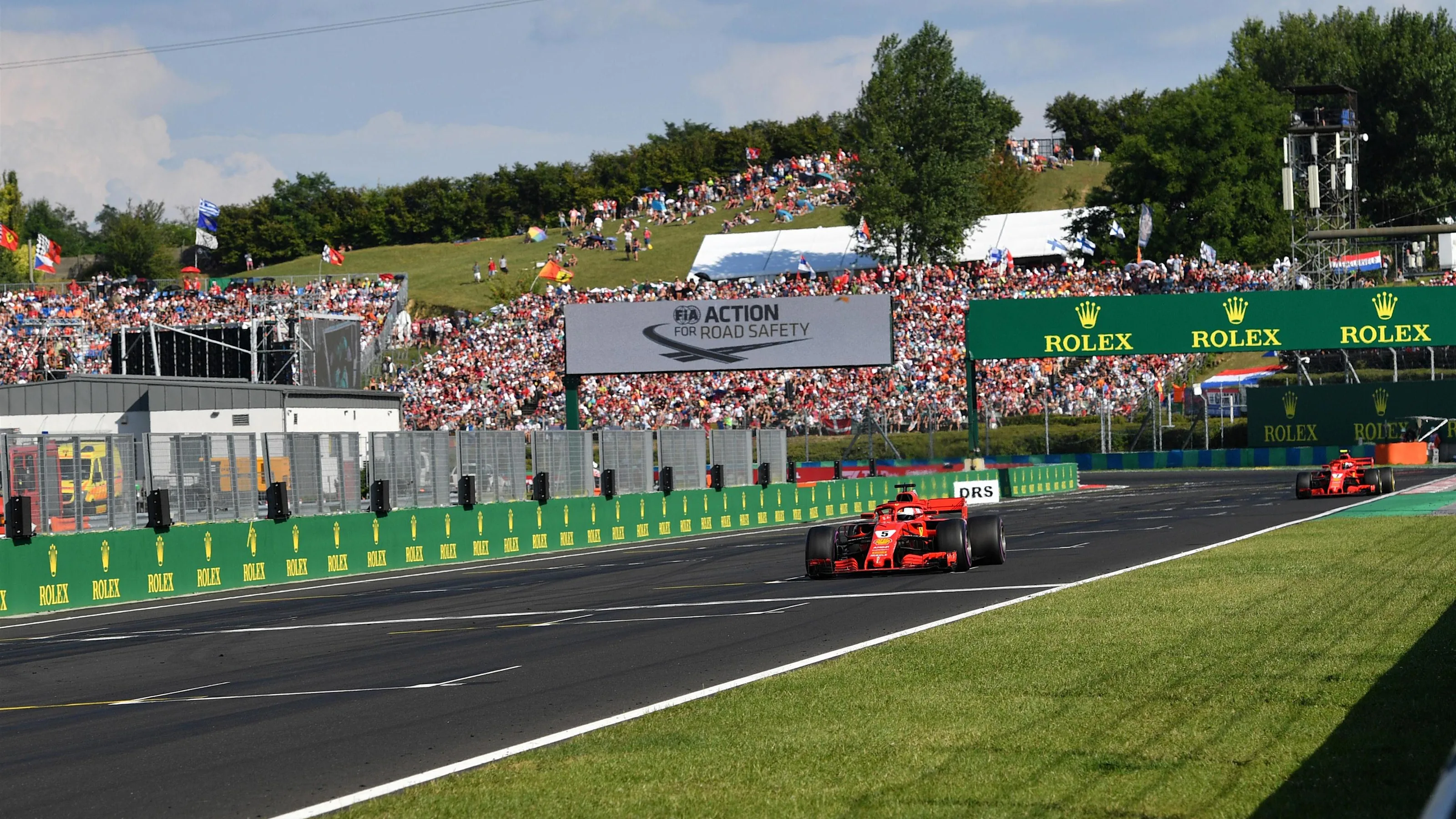 Sebastian Vettel (GER) Ferrari SF-71H leads Kimi Raikkonen (FIN) Ferrari SF-71H at Formula One