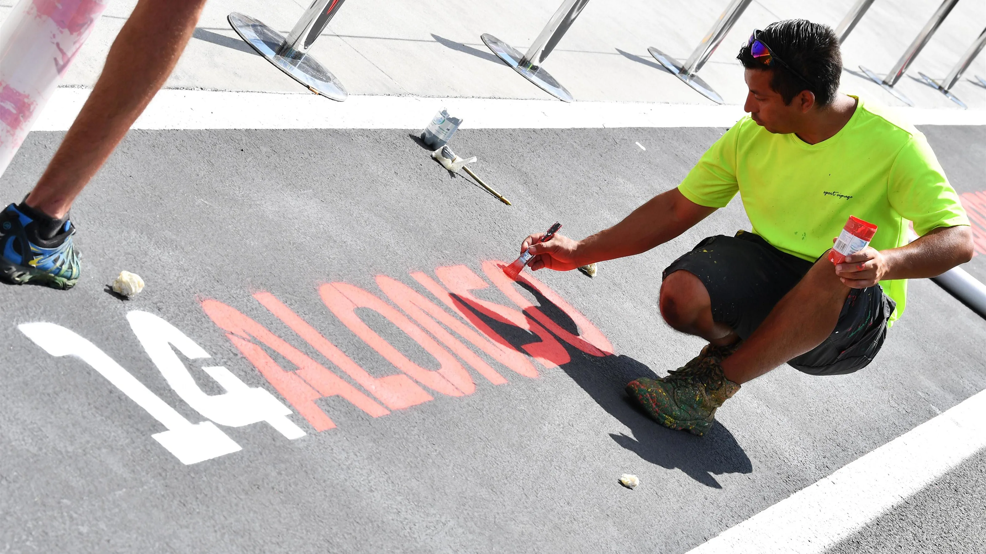 Pit lane markings are applied at Formula One World Championship, Rd12, Hungarian Grand Prix,