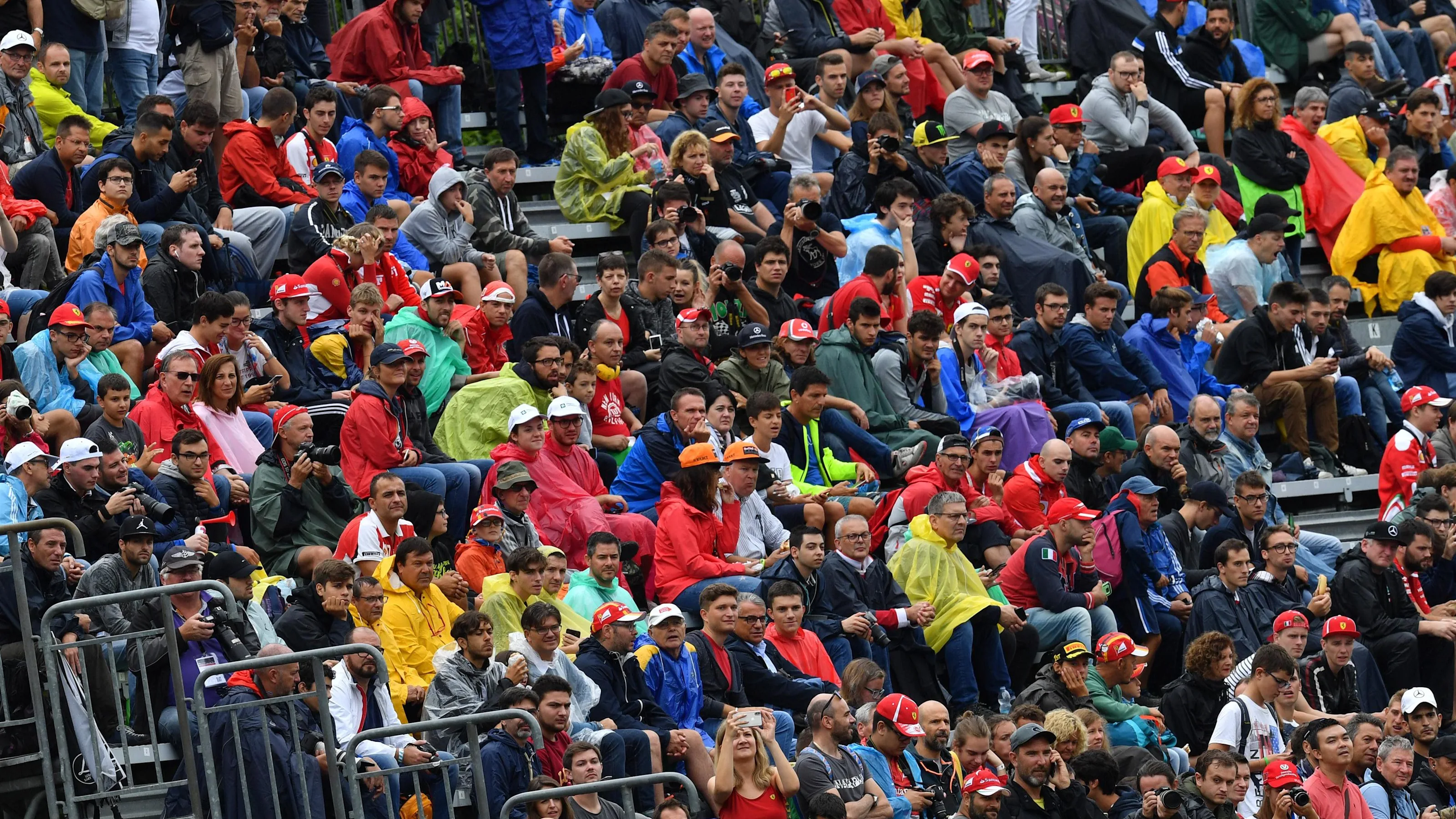 Fans in the rain at Formula One World Championship, Rd14, Italian Grand Prix, Practice, Monza,