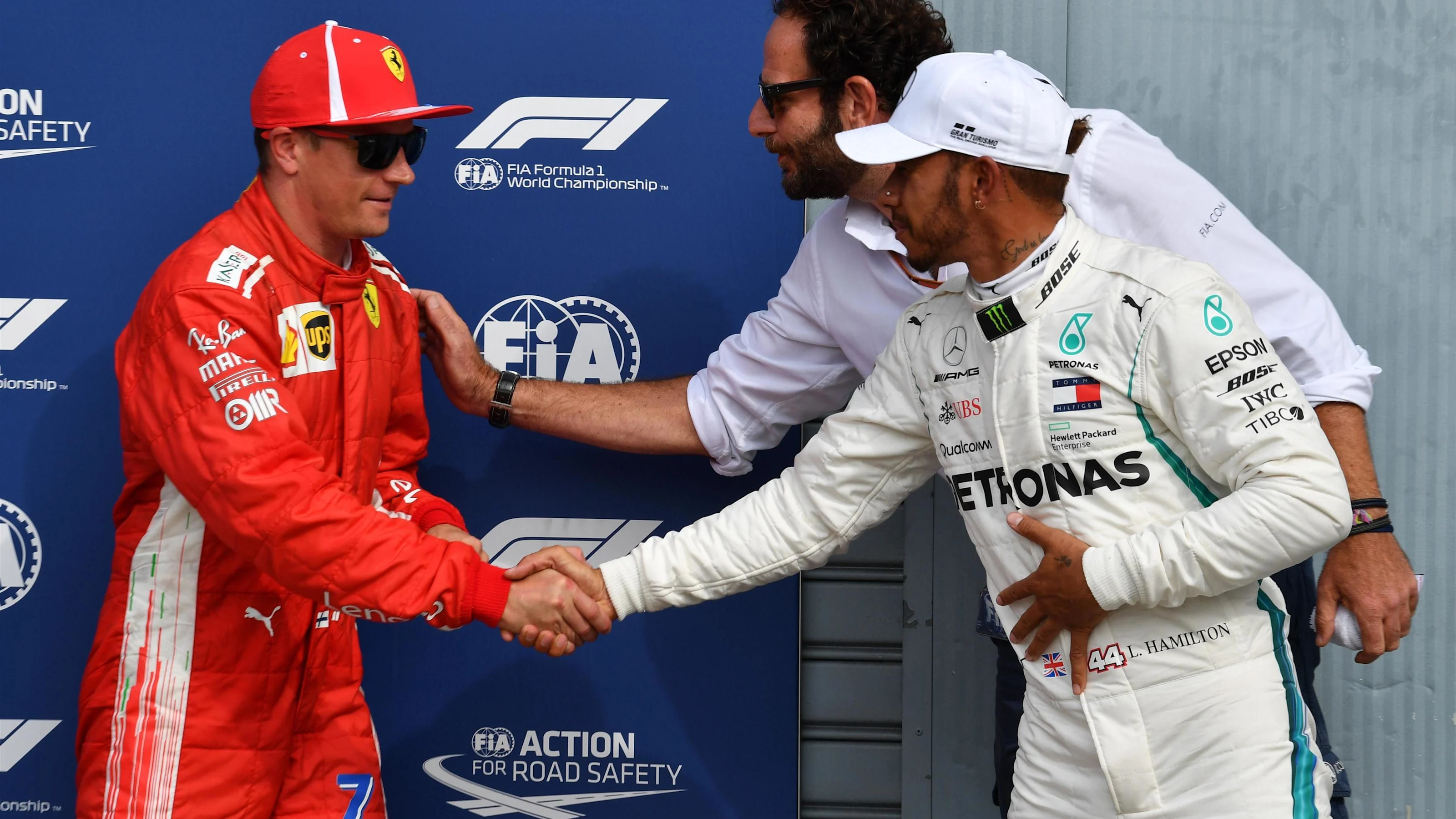 Pole sitter Kimi Raikkonen, Ferrari celebrates in parc ferme with Lewis Hamilton, Mercedes AMG F1