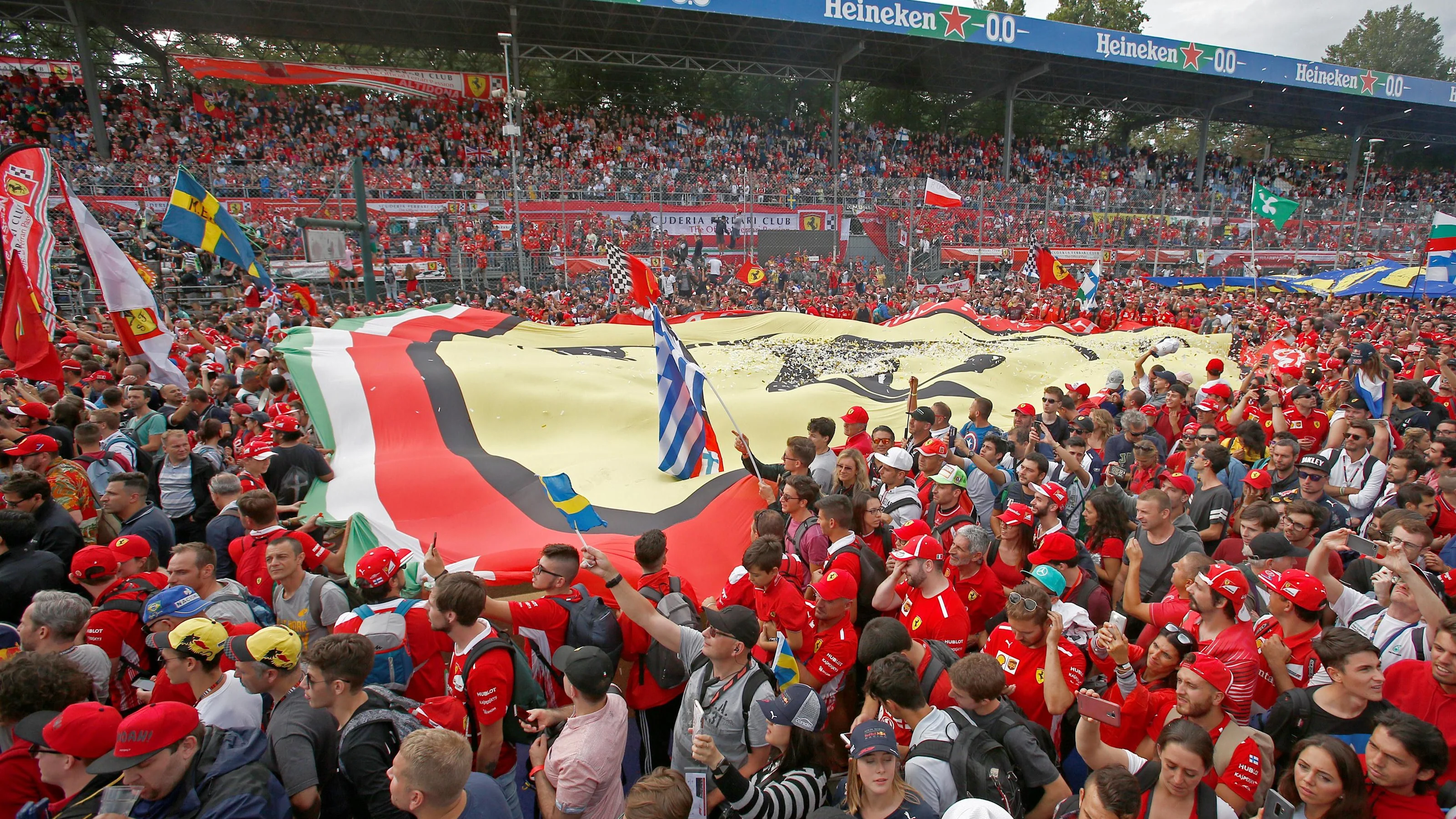 Ferrari fans with giant ferrari flag at Formula One World Championship, Rd14, Italian Grand Prix,