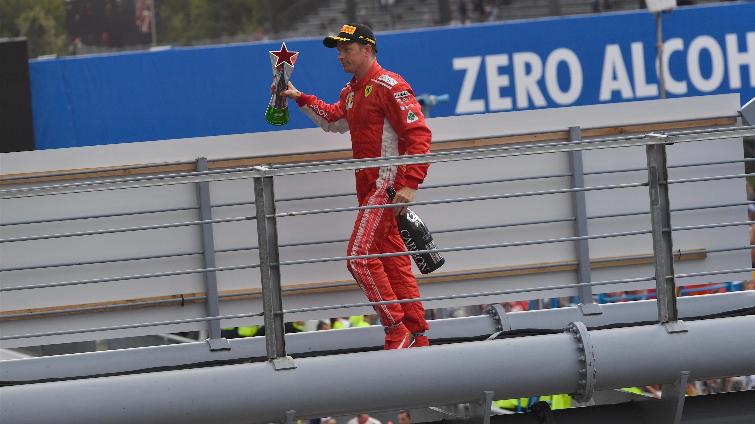 Kimi Raikkonen, Ferrari celebrates with trophy and champagne at Formula One World Championship,