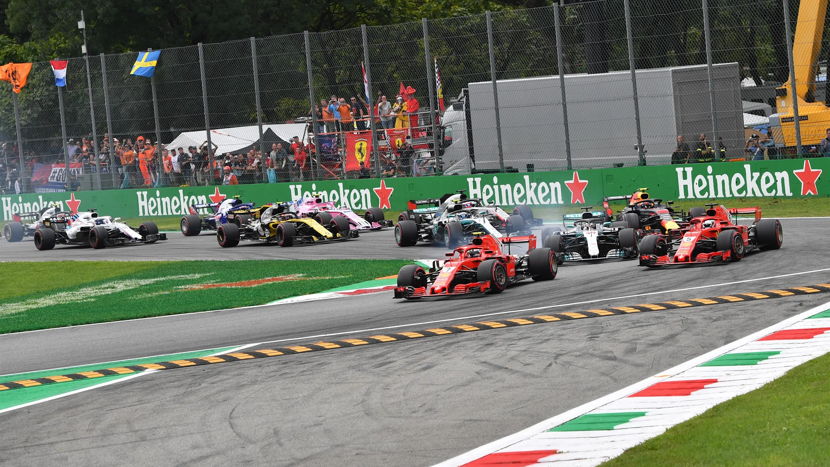 Kimi Raikkonen, Ferrari SF71H leads Sebastian Vettel, Ferrari SF71H and Lewis Hamilton, Mercedes