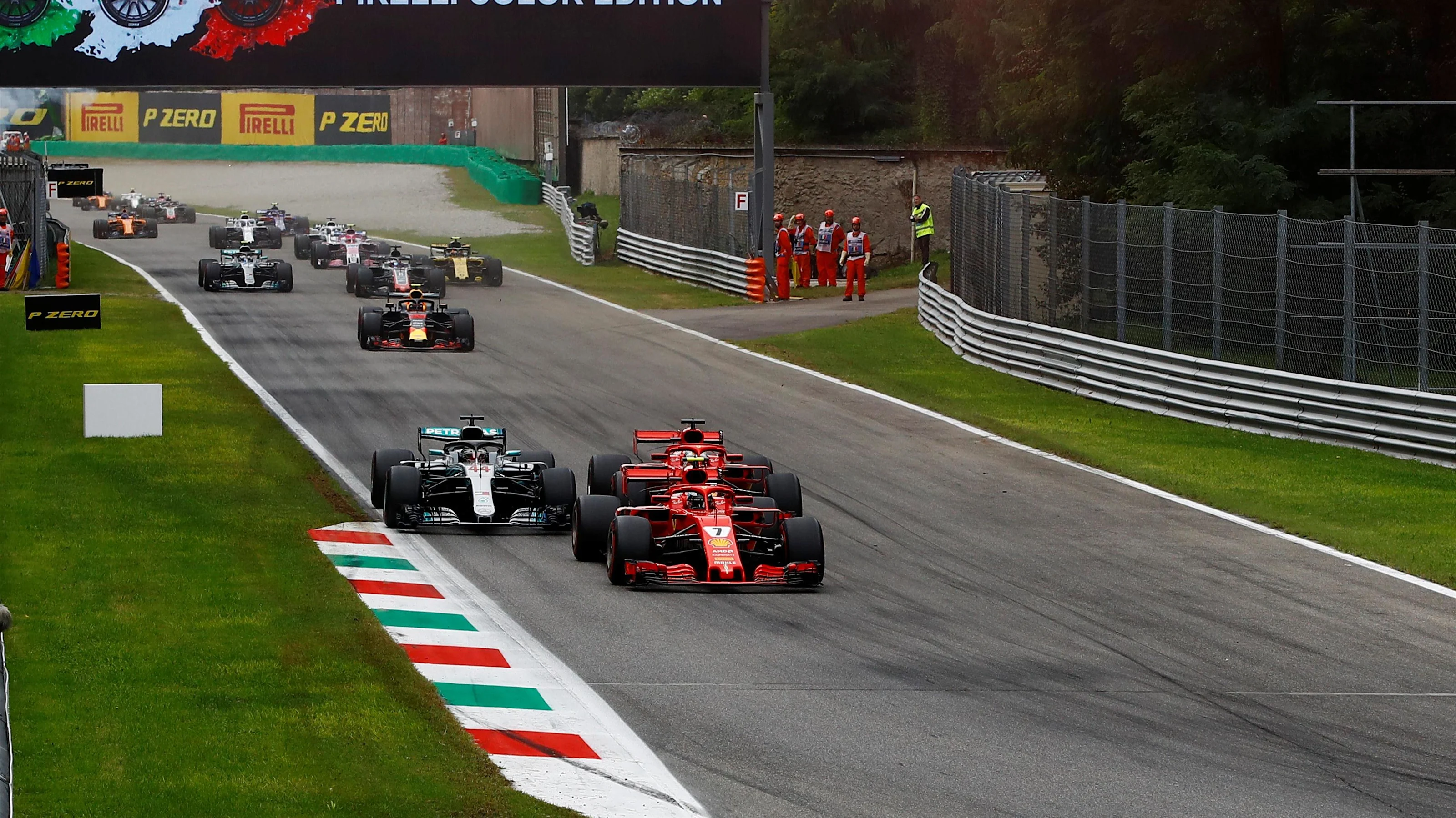 Kimi Raikkonen, Ferrari SF71H, Sebastian Vettel, Ferrari SF71H and Lewis Hamilton, Mercedes AMG F1