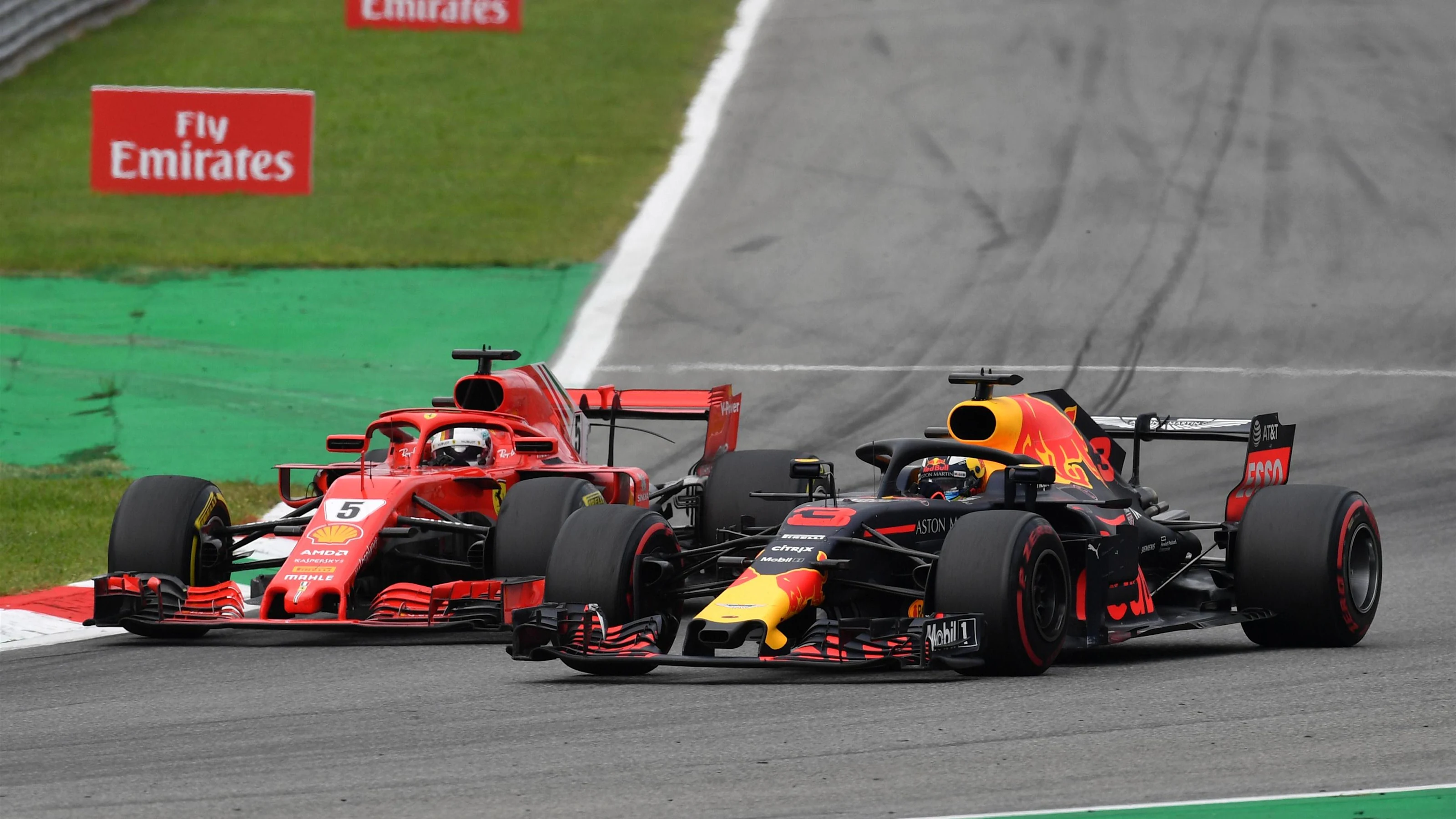 Sebastian Vettel, Ferrari SF71H and Daniel Ricciardo, Red Bull Racing RB14 battle at Formula One