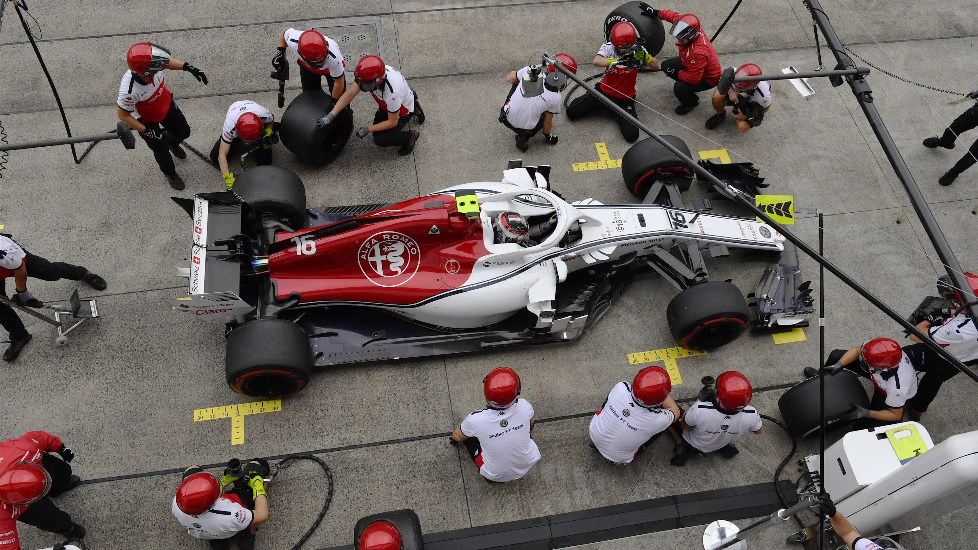 Charles Leclerc, Alfa Romeo Sauber C37 pit stop at Formula One World Championship, Rd17, Japanese