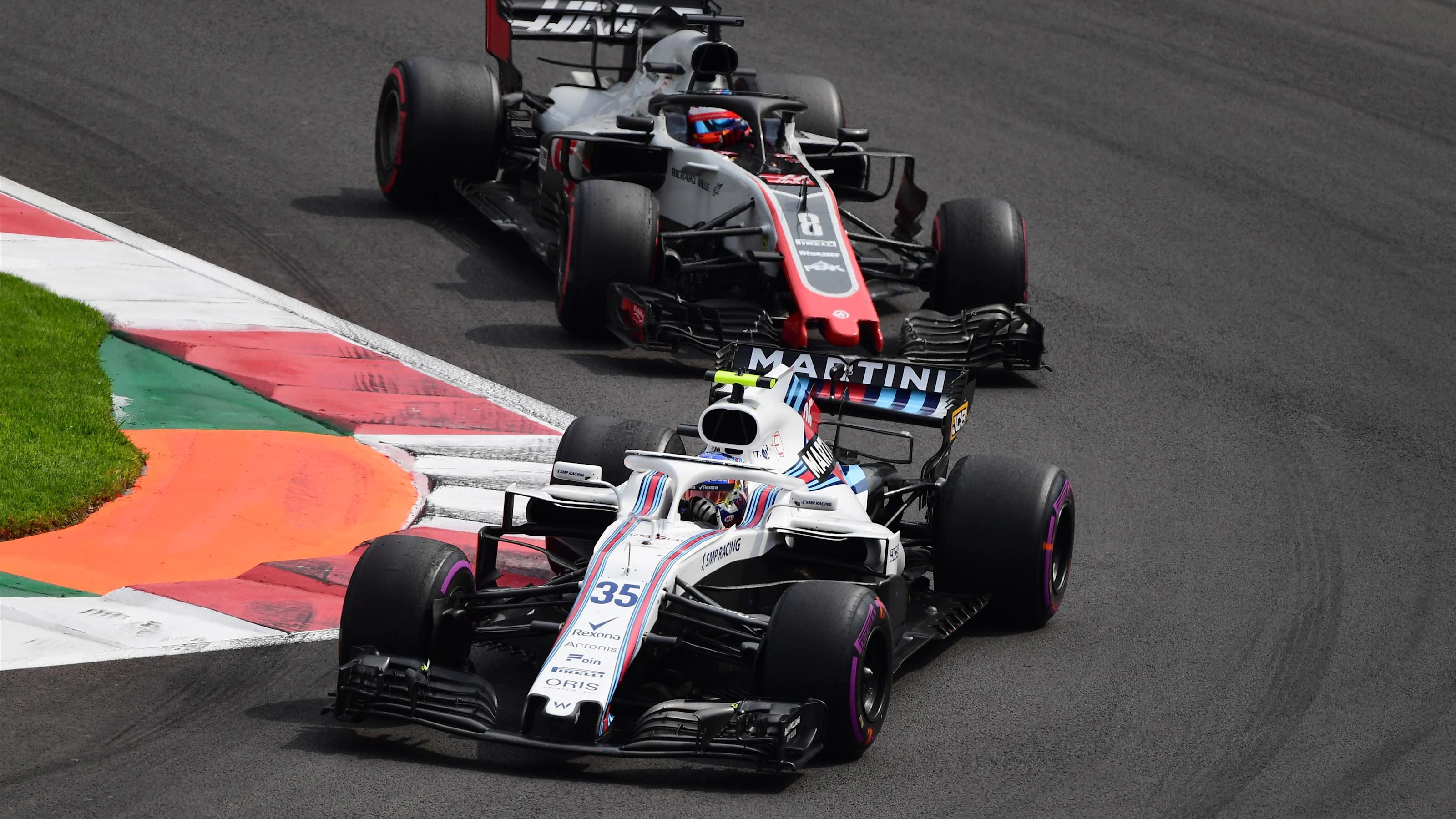 Sergey Sirotkin, Williams FW41 and Romain Grosjean, Haas F1 Team VF-18 at Formula One World
