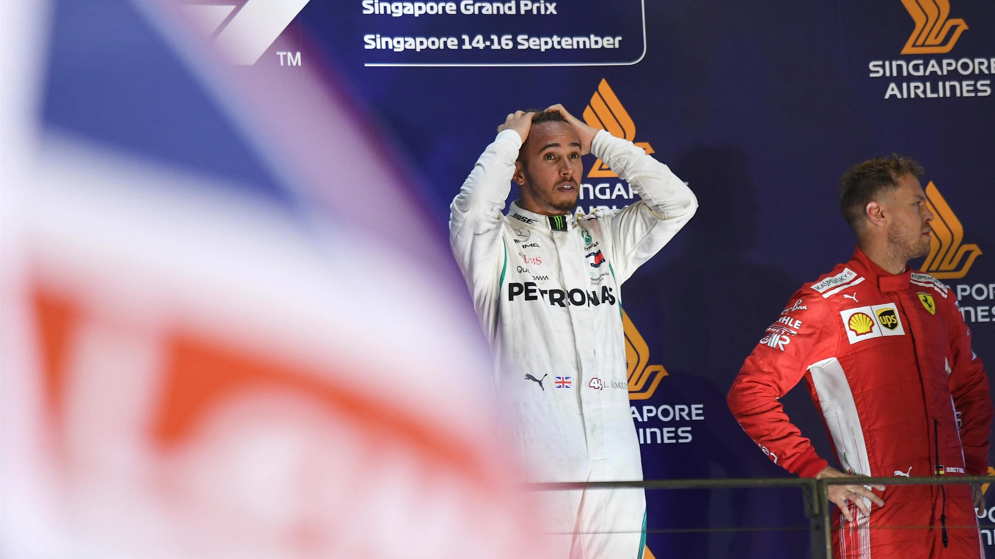 (L to R): Lewis Hamilton, Mercedes AMG F1 and Sebastian Vettel, Ferrari celebrate on the podium at