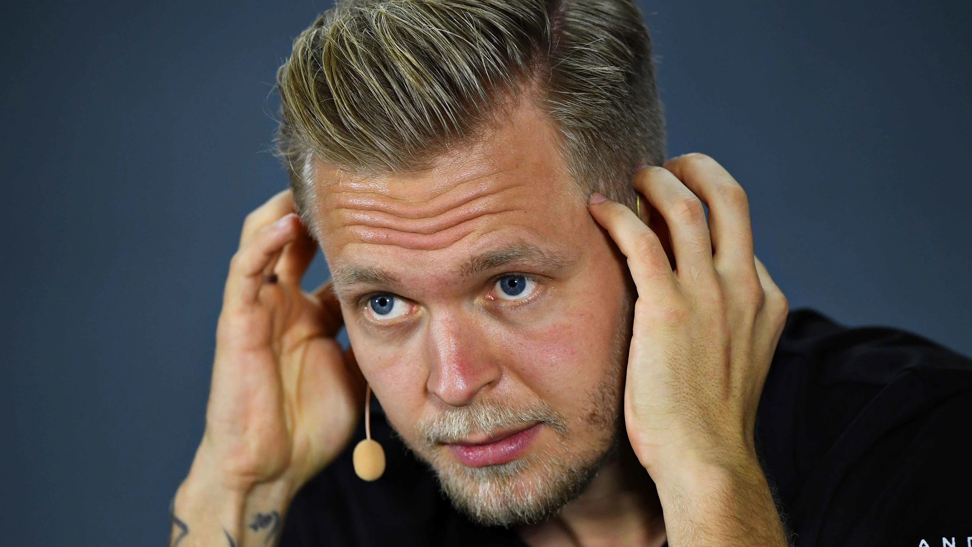 ABU DHABI, UNITED ARAB EMIRATES - NOVEMBER 28: Kevin Magnussen of Denmark and Haas F1 looks on in