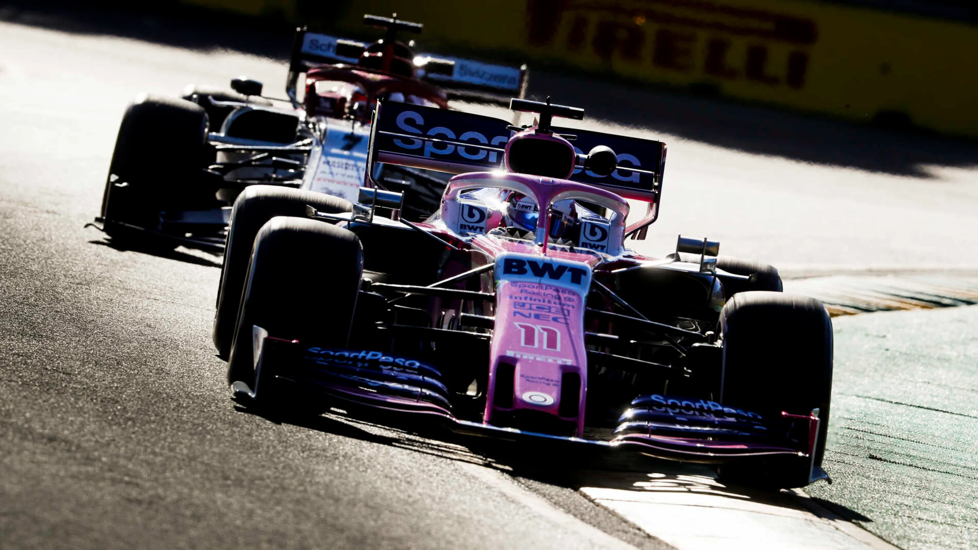 MELBOURNE GRAND PRIX CIRCUIT, AUSTRALIA - MARCH 15: Sergio Perez, Racing Point RP19, leads Kimi