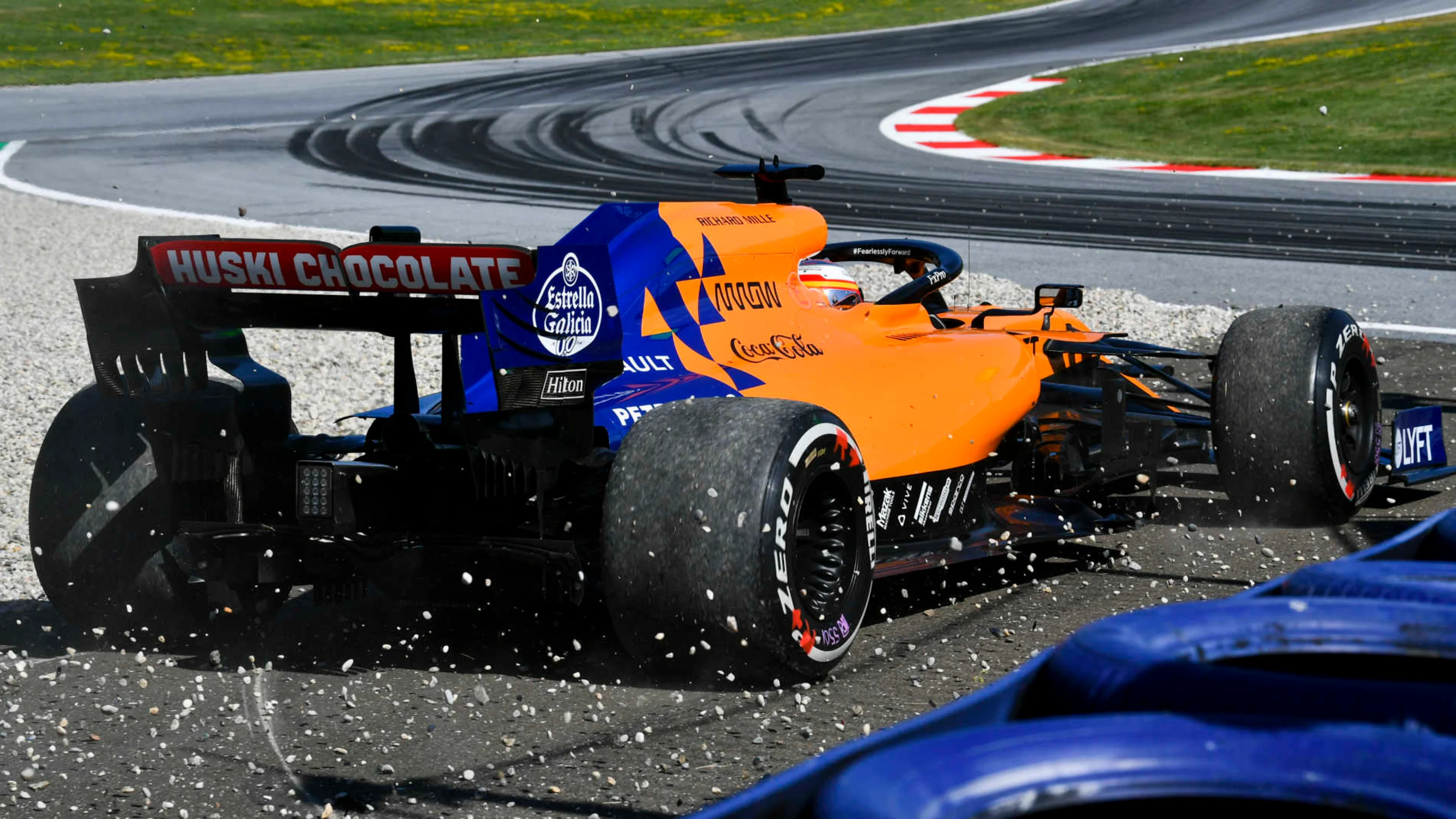 RED BULL RING, AUSTRIA - JUNE 28: Carlos Sainz Jr., McLaren MCL34, runs through a gravel trap