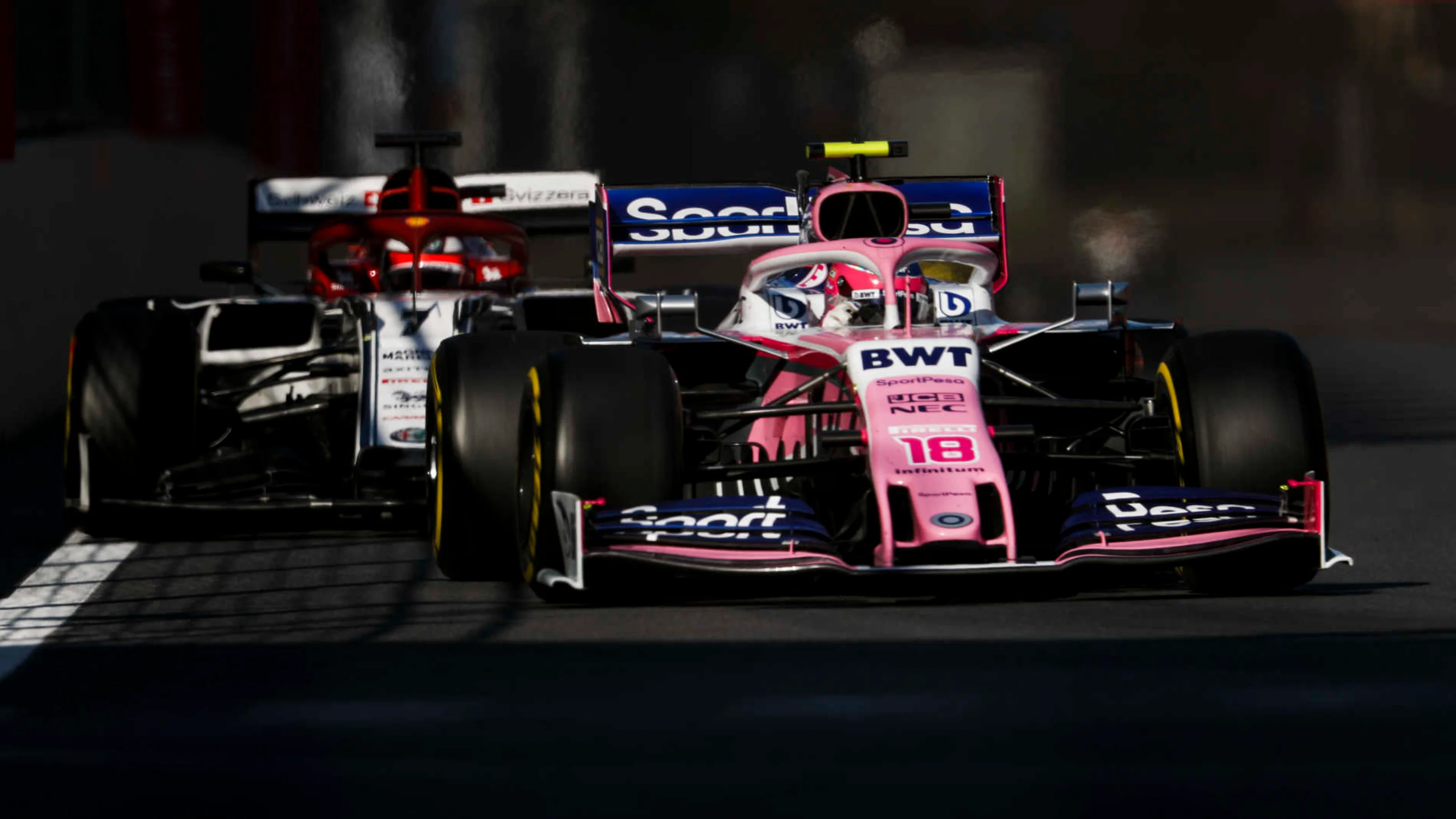BAKU CITY CIRCUIT, AZERBAIJAN - APRIL 28: Lance Stroll, Racing Point RP19, leads Kimi Raikkonen,