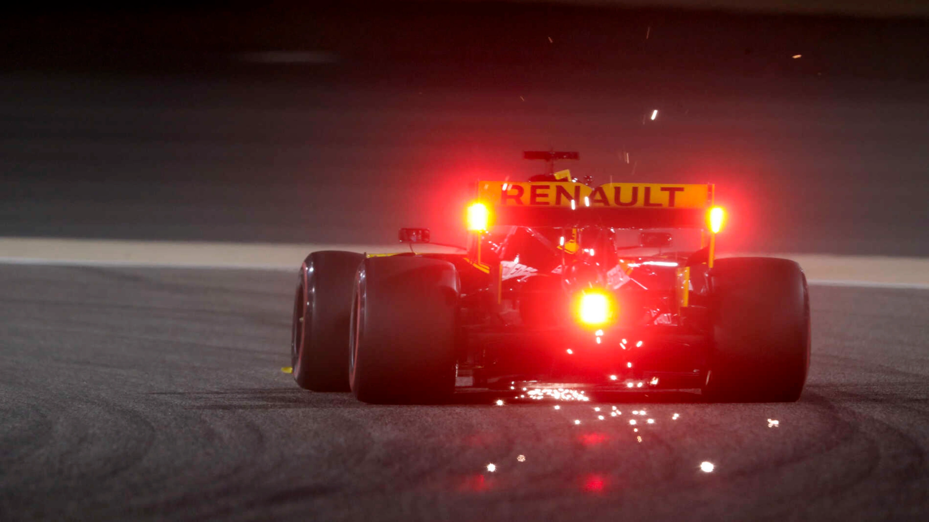 BAHRAIN INTERNATIONAL CIRCUIT, BAHRAIN - MARCH 30: Sparks fly from the rear of Daniel Ricciardo,