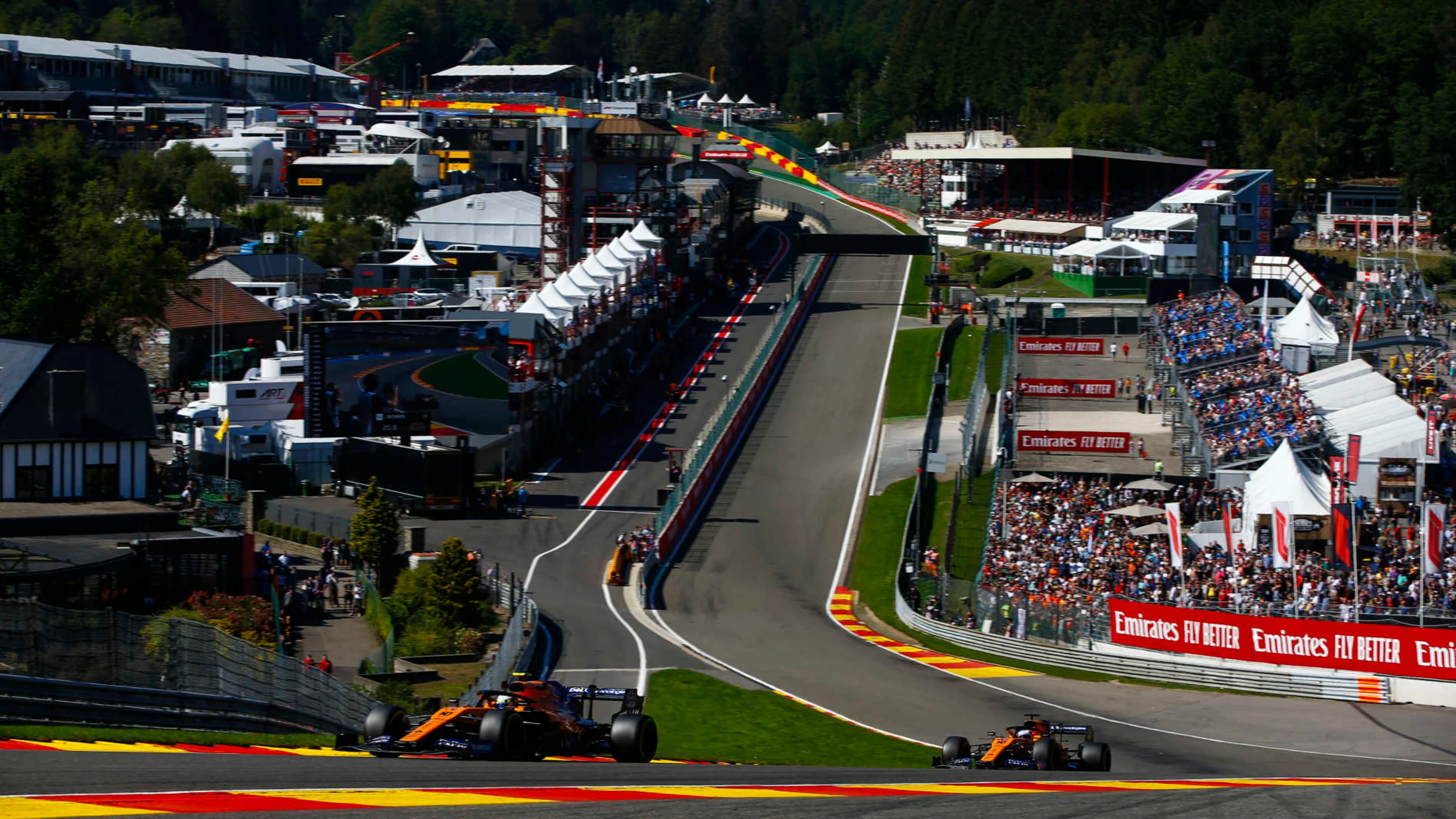 SPA-FRANCORCHAMPS, BELGIUM - AUGUST 30: Lando Norris, McLaren MCL34, leads Carlos Sainz Jr.,