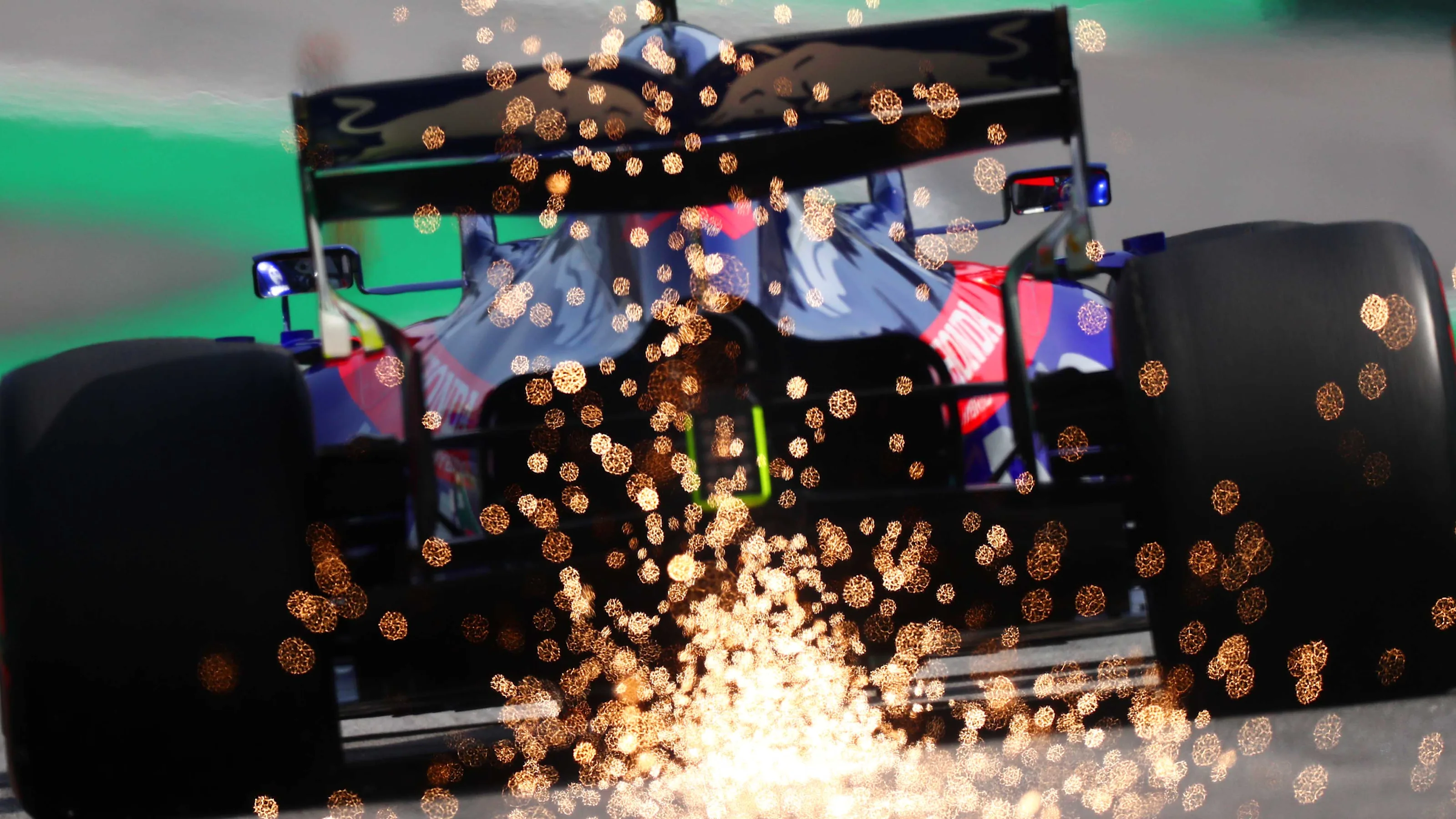 SAO PAULO, BRAZIL - NOVEMBER 17: Sparks fly behind Pierre Gasly of France driving the (10) Scuderia