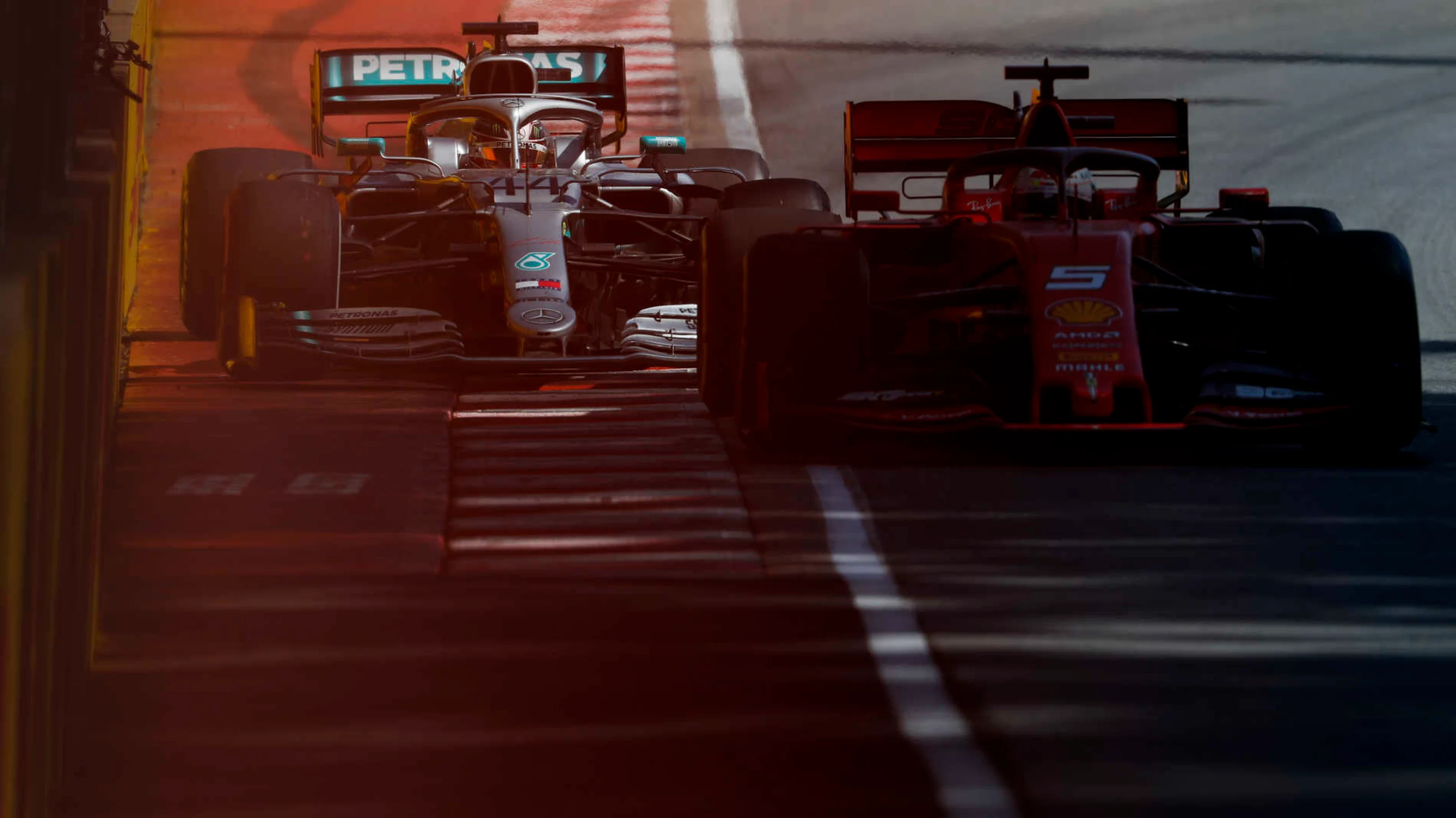 CIRCUIT GILLES-VILLENEUVE, CANADA - JUNE 09: Sebastian Vettel, Ferrari SF90, leads Lewis Hamilton,