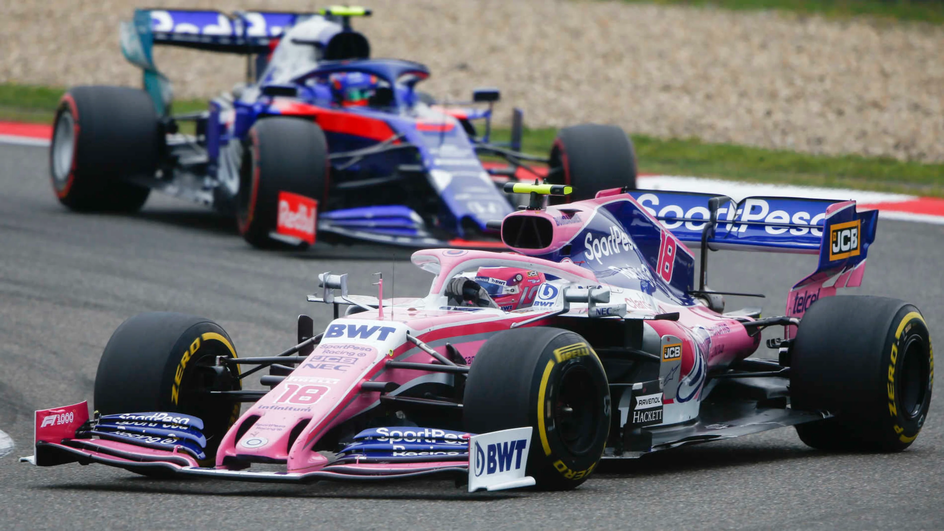 SHANGHAI INTERNATIONAL CIRCUIT, CHINA - APRIL 14: Lance Stroll, Racing Point RP19, leads Alexander