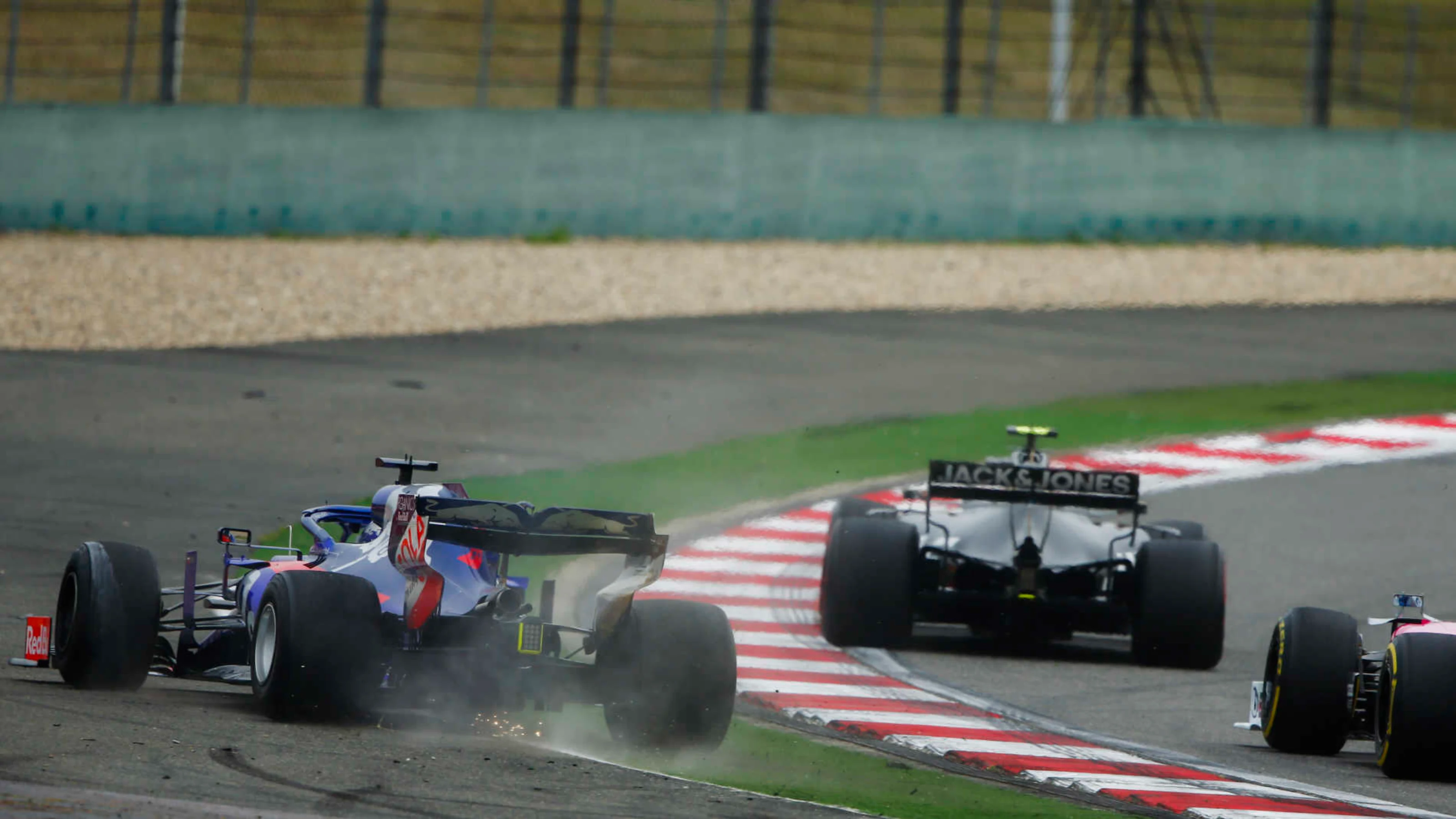 SHANGHAI INTERNATIONAL CIRCUIT, CHINA - APRIL 14: Daniil Kvyat, Toro Rosso STR14, runs wide during