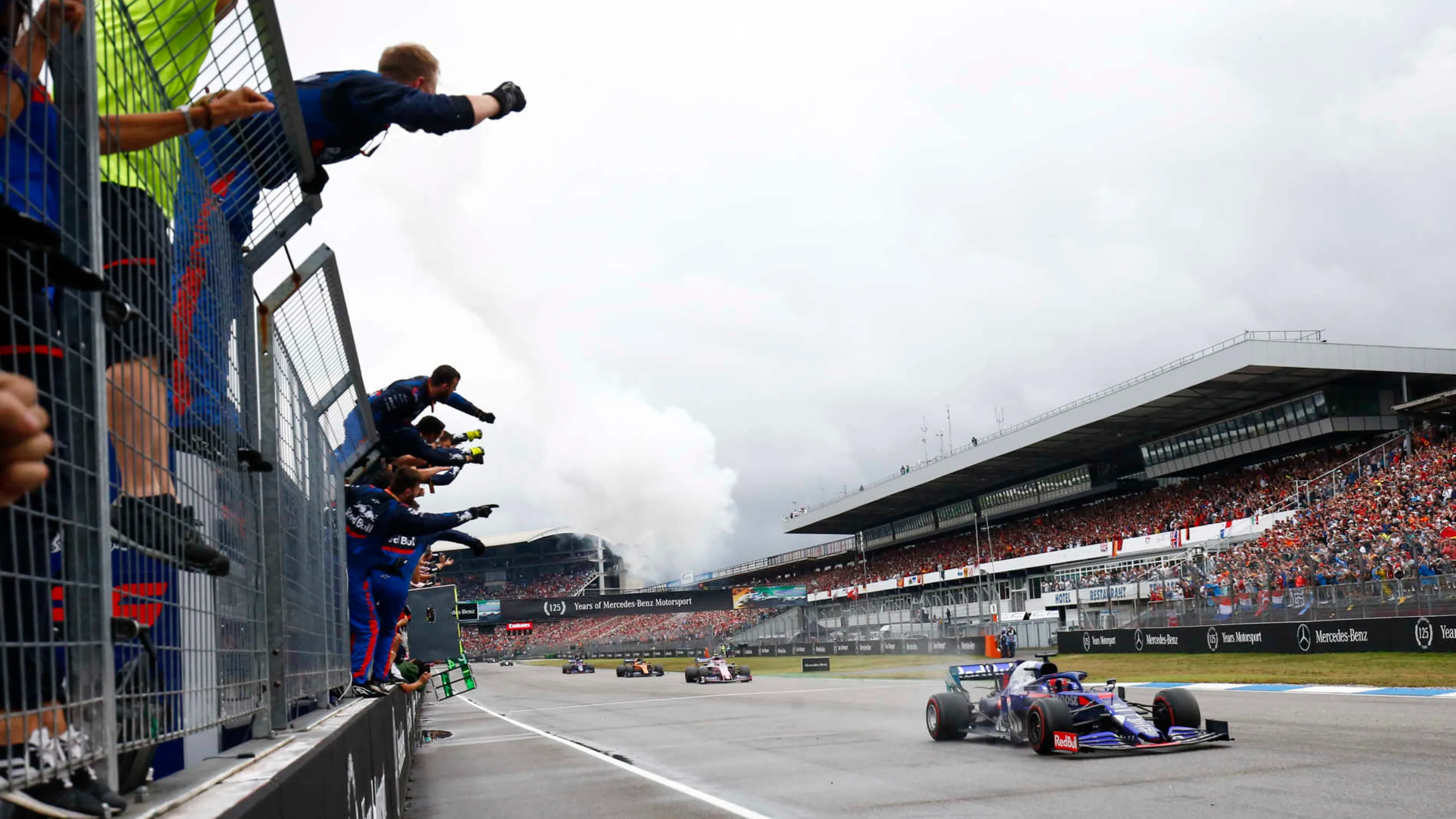 HOCKENHEIMRING, GERMANY - JULY 28: The Toro Rosso team cheer as Daniil Kvyat, Toro Rosso STR14, 3rd