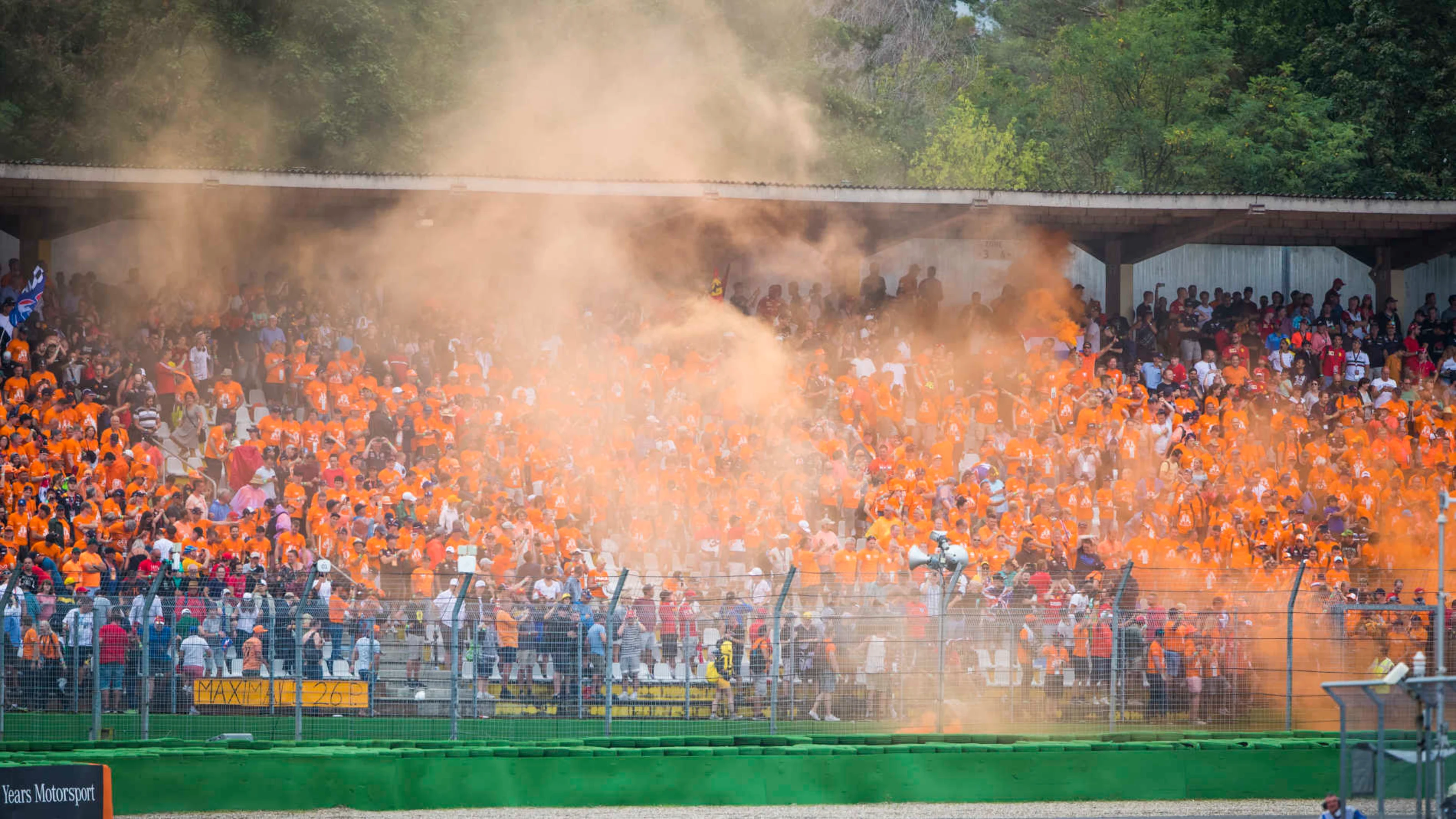 HOCKENHEIMRING, GERMANY - JULY 28: Orange fans and orange smoke celebrate a win for Max Verstappen,