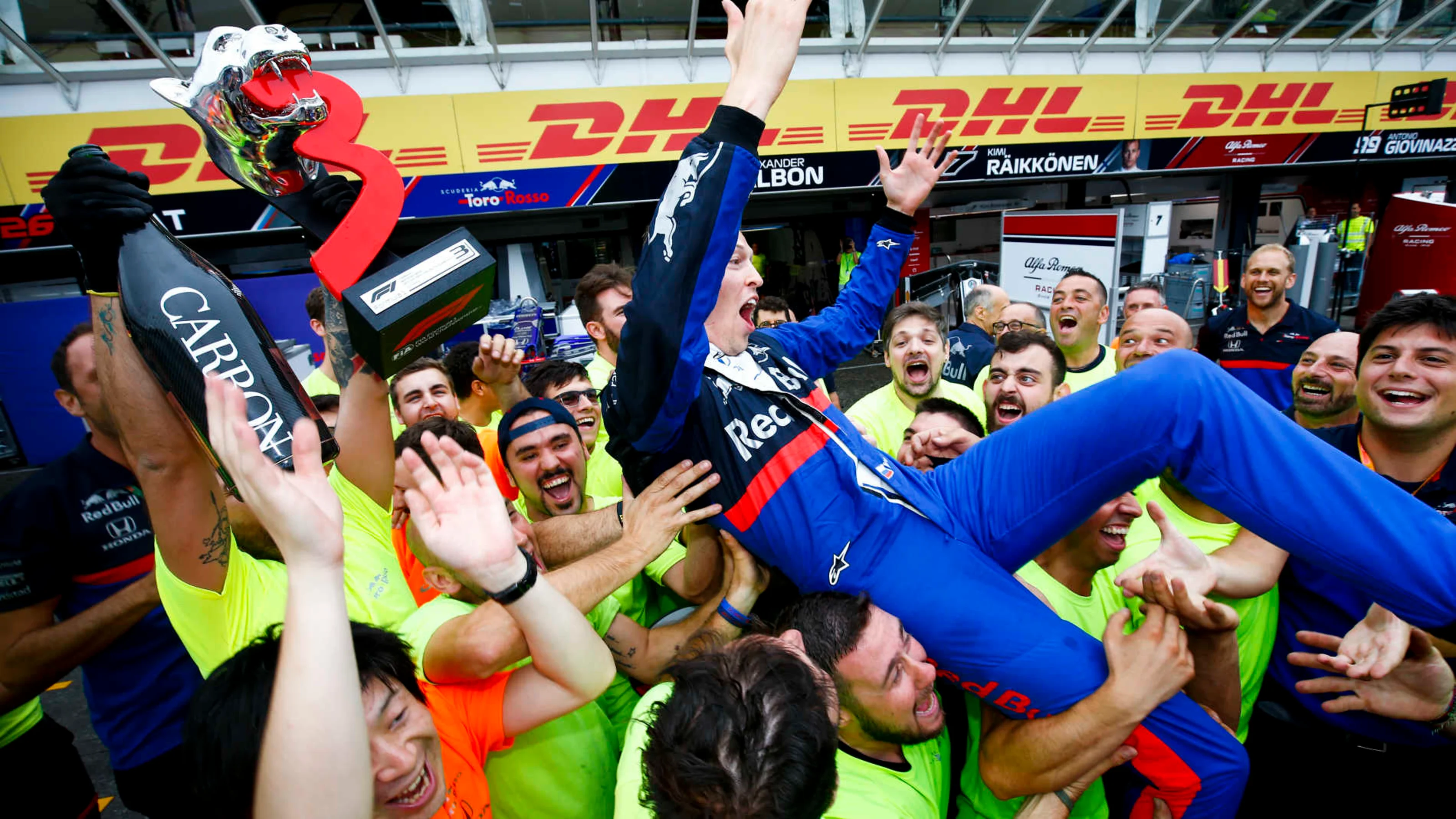 HOCKENHEIMRING, GERMANY - JULY 28: Daniil Kvyat, Toro Rosso, 3rd position, and the Toro Rosso team