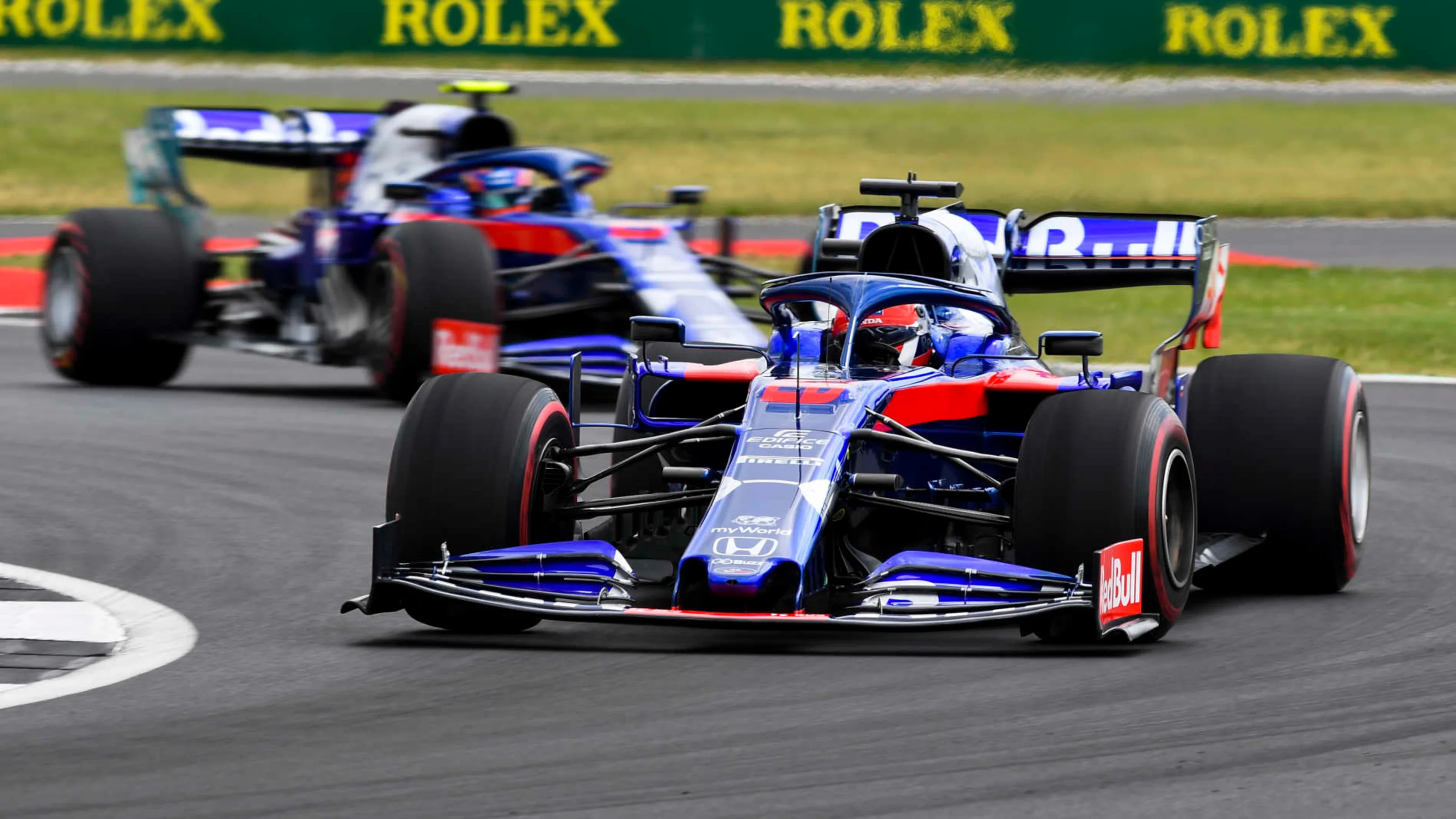 SILVERSTONE, UNITED KINGDOM - JULY 12: Daniil Kvyat, Toro Rosso STR14, leads Alexander Albon, Toro
