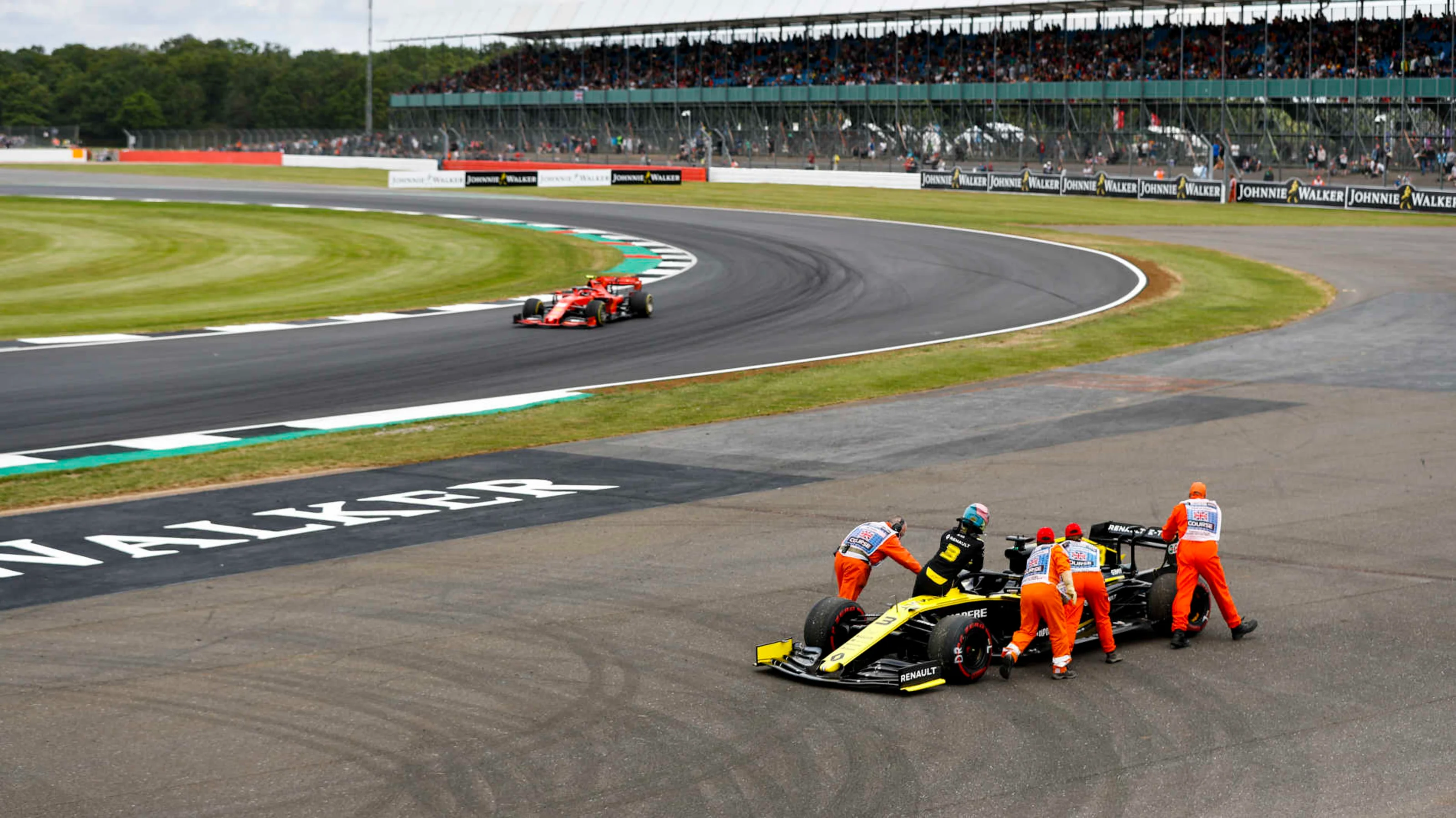 SILVERSTONE, UNITED KINGDOM - JULY 12: Charles Leclerc, Ferrari SF90 passing the car of Daniel