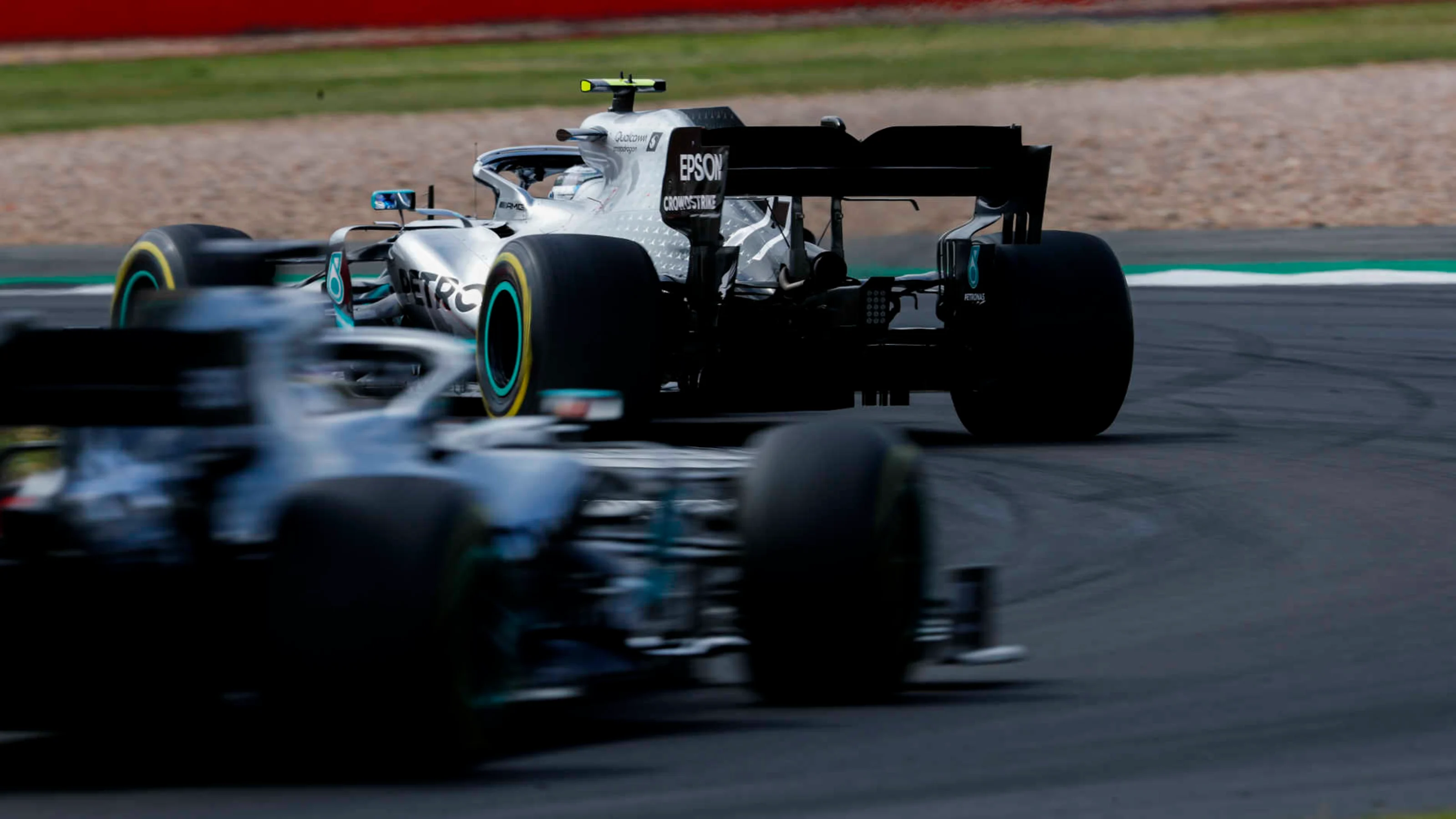 SILVERSTONE, UNITED KINGDOM - JULY 14: Valtteri Bottas, Mercedes AMG W10, leads Lewis Hamilton,