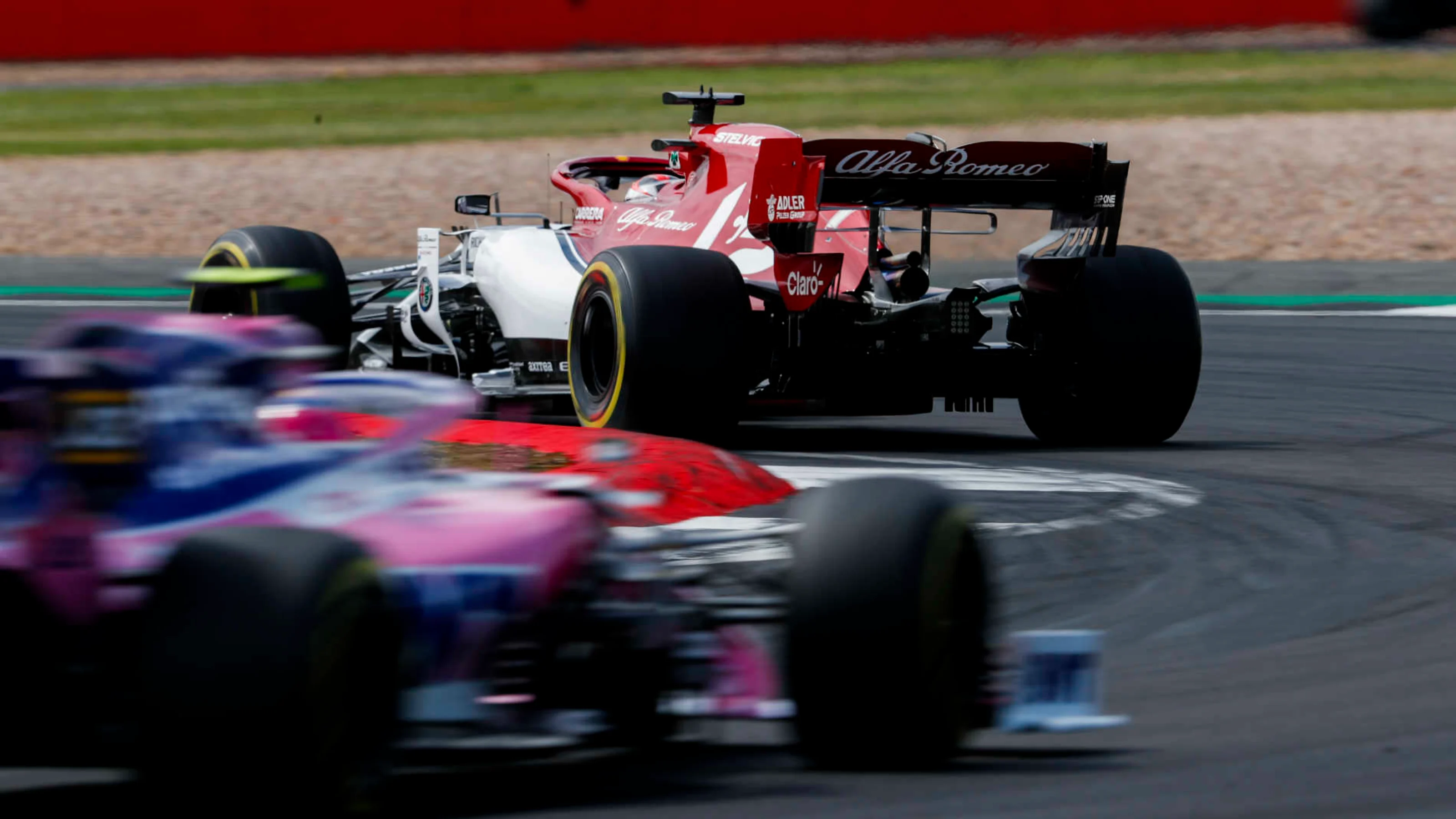 SILVERSTONE, UNITED KINGDOM - JULY 14: Kimi Raikkonen, Alfa Romeo Racing C38, leads Lance Stroll,