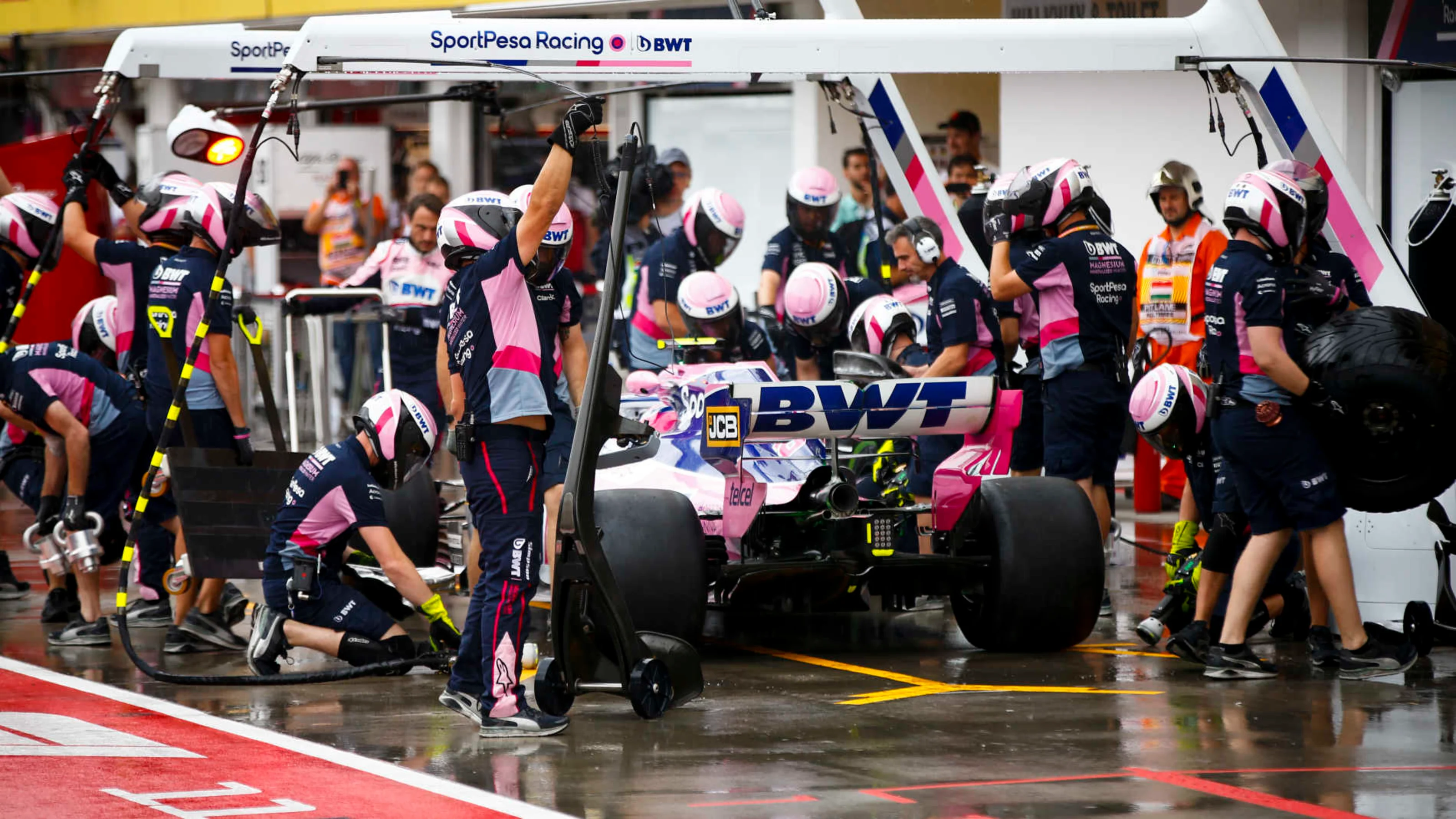 HUNGARORING, HUNGARY - AUGUST 02: Lance Stroll, Racing Point RP19, makes a pit stop during practice