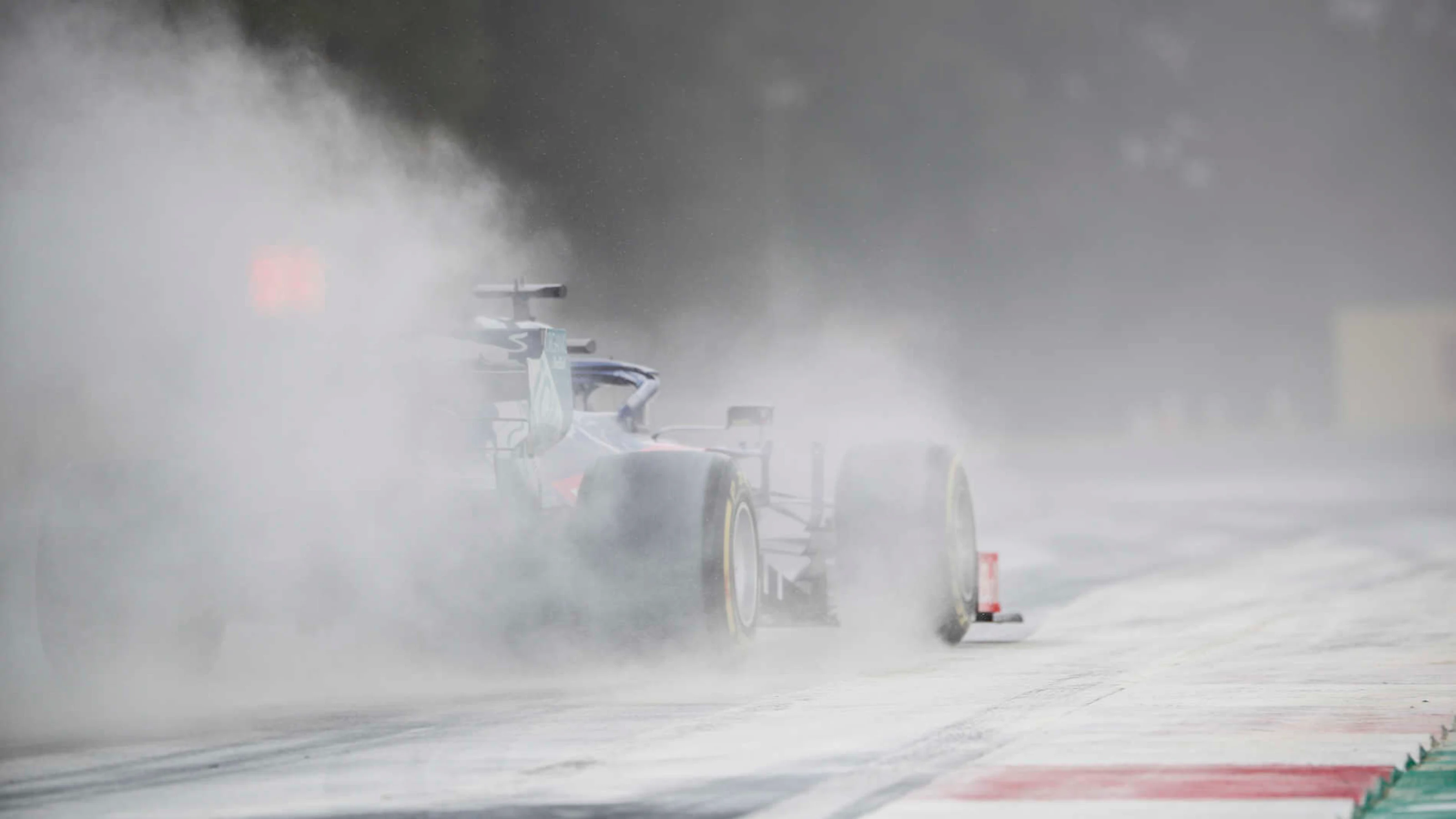 HUNGARORING, HUNGARY - AUGUST 03: Daniil Kvyat, Toro Rosso STR14, kicks up cement dust which was