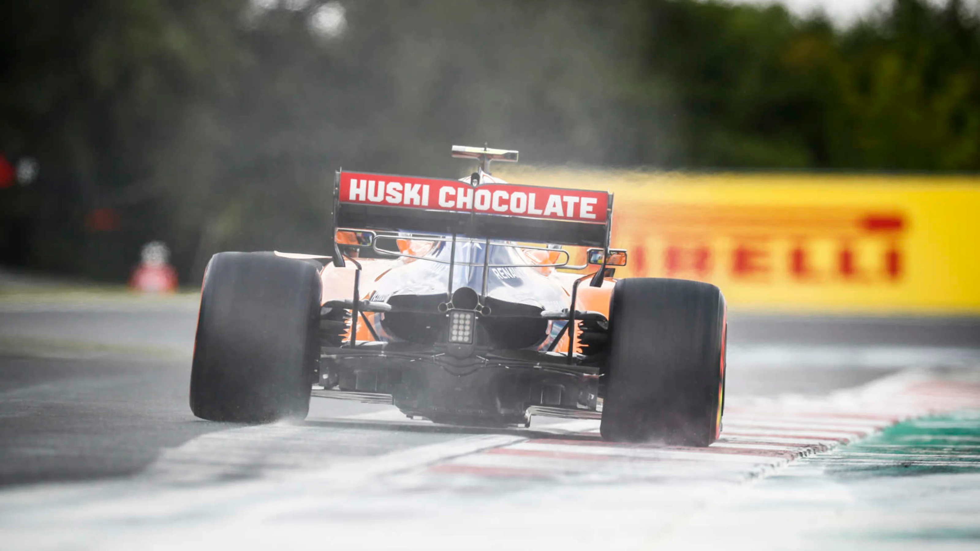 HUNGARORING, HUNGARY - AUGUST 03: Carlos Sainz Jr., McLaren MCL34, kicks up cement dust during the