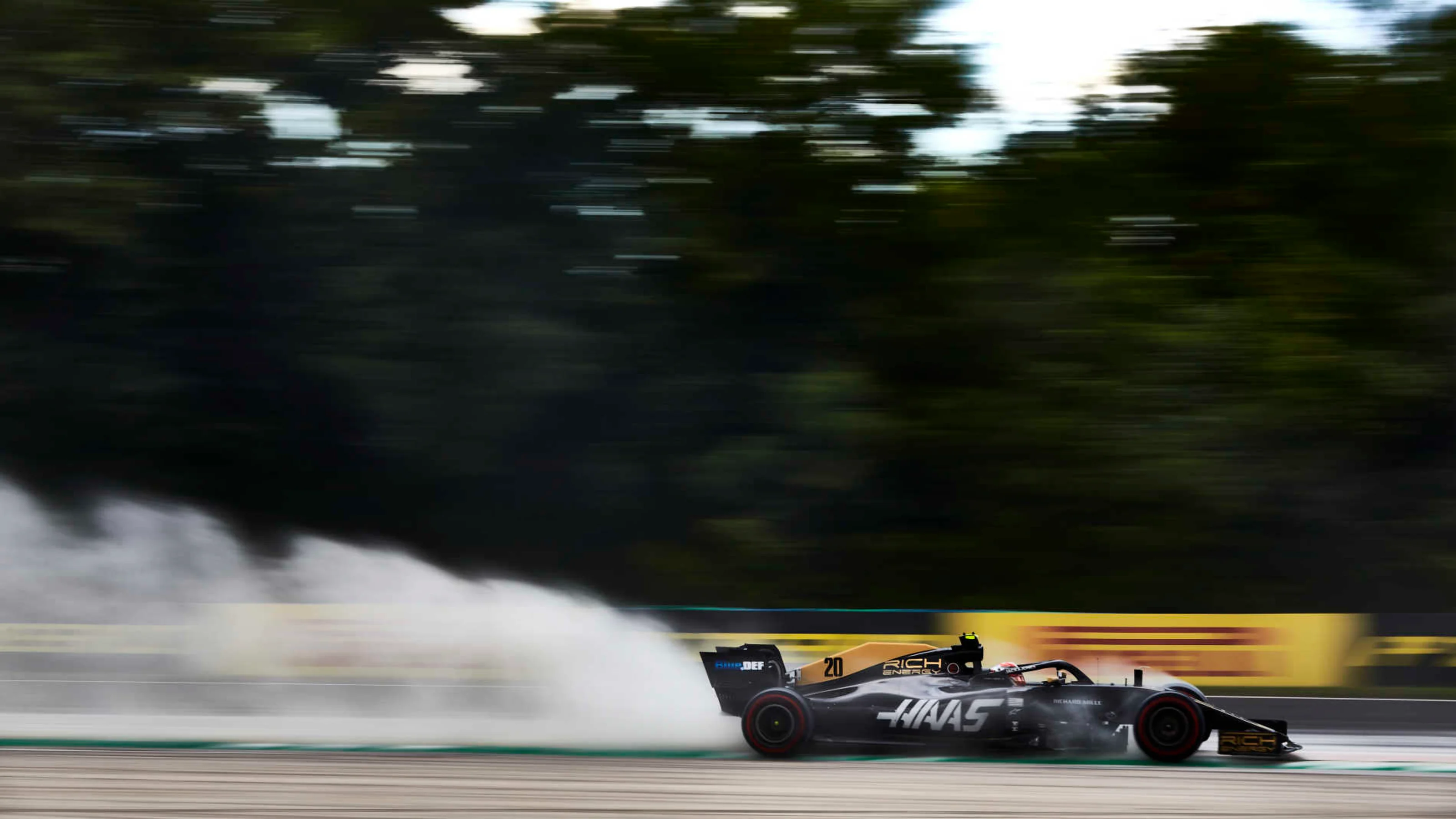 HUNGARORING, HUNGARY - AUGUST 03: Kevin Magnussen, Haas VF-19, kicks up cement dust used to cover