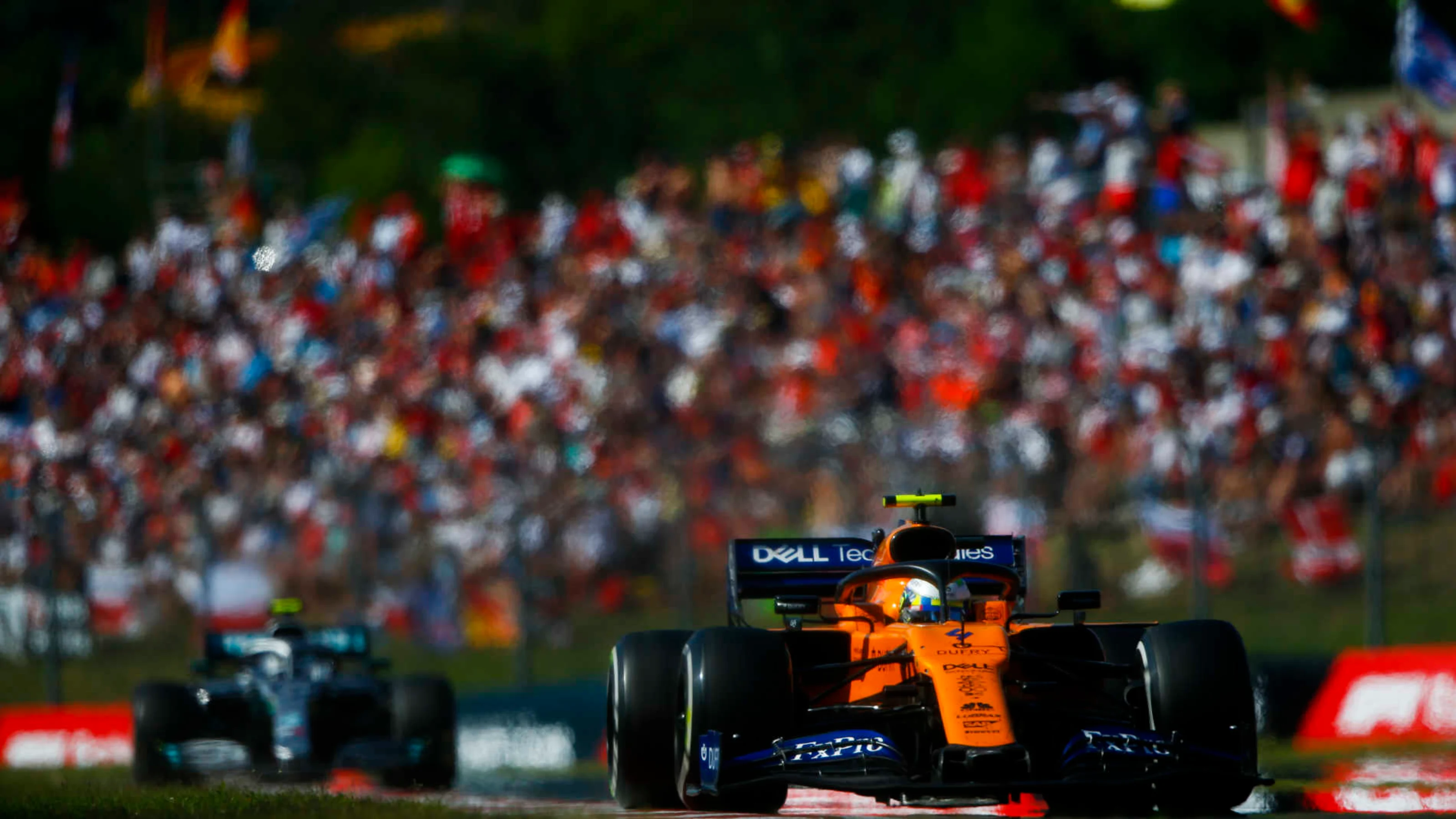 HUNGARORING, HUNGARY - AUGUST 04: Lando Norris, McLaren MCL34, leads Valtteri Bottas, Mercedes AMG