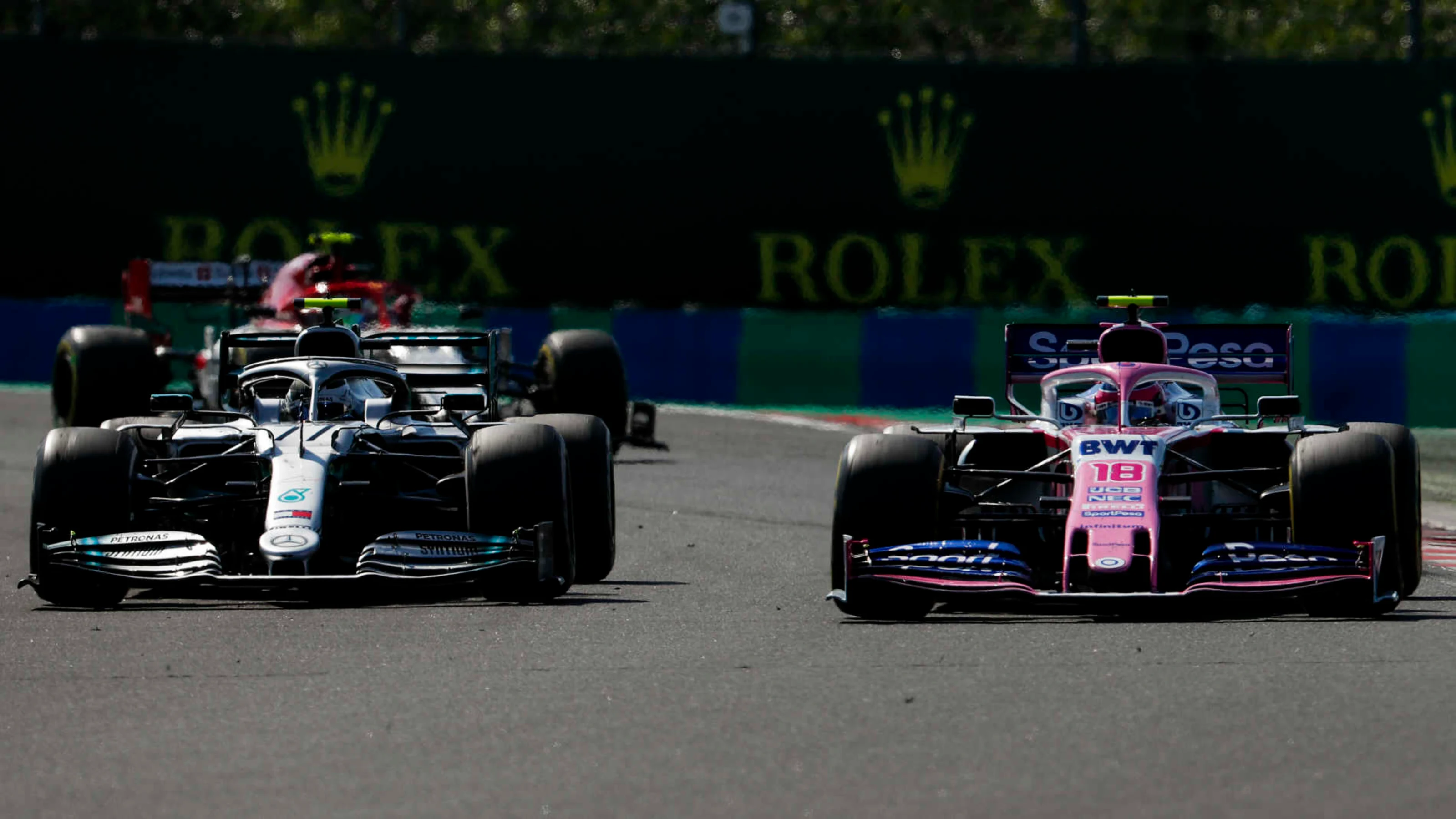 HUNGARORING, HUNGARY - AUGUST 04: Valtteri Bottas, Mercedes AMG W10, battles with Lance Stroll,