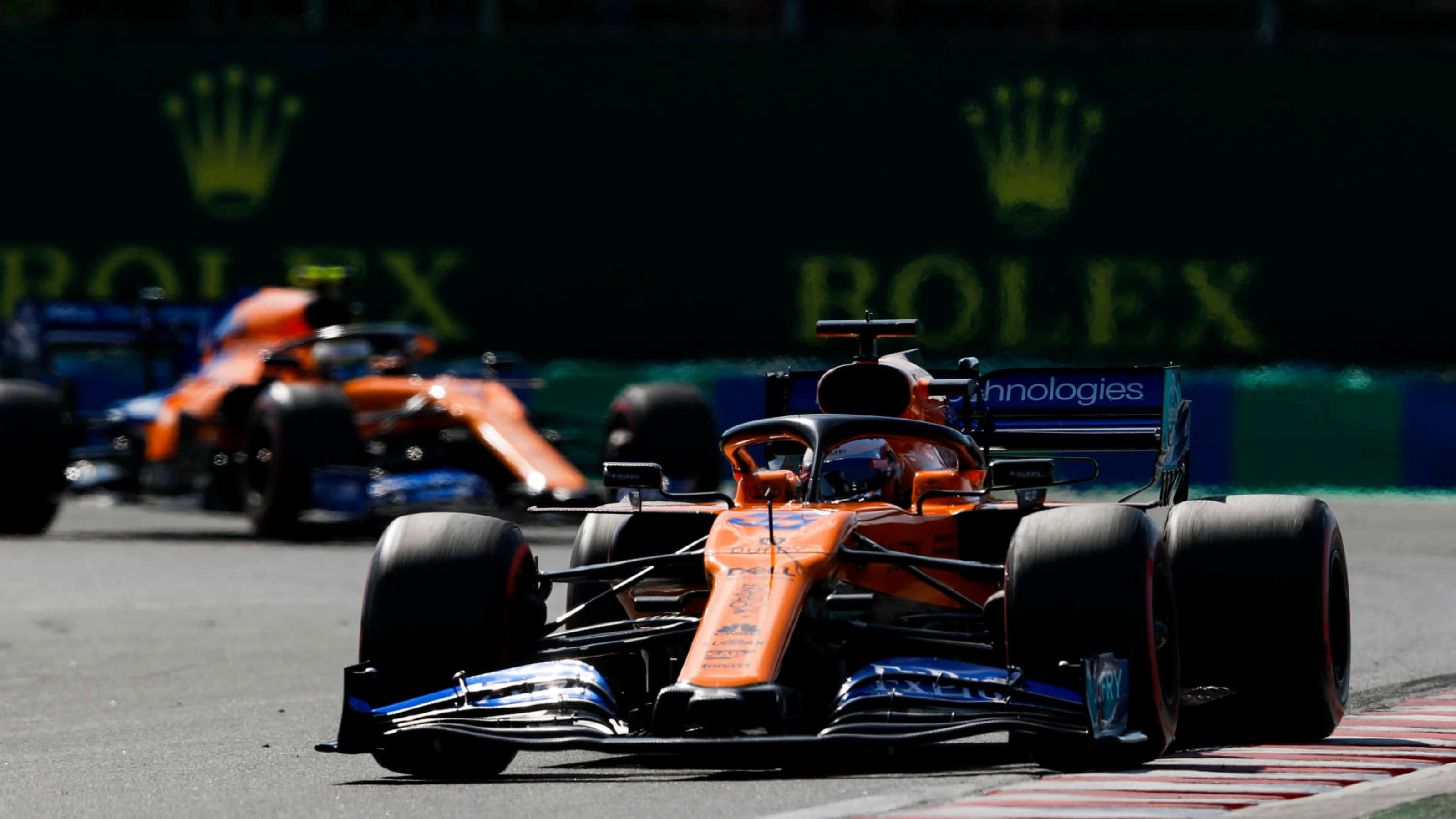 HUNGARORING, HUNGARY - AUGUST 04: Carlos Sainz Jr., McLaren MCL34, leads Lando Norris, McLaren