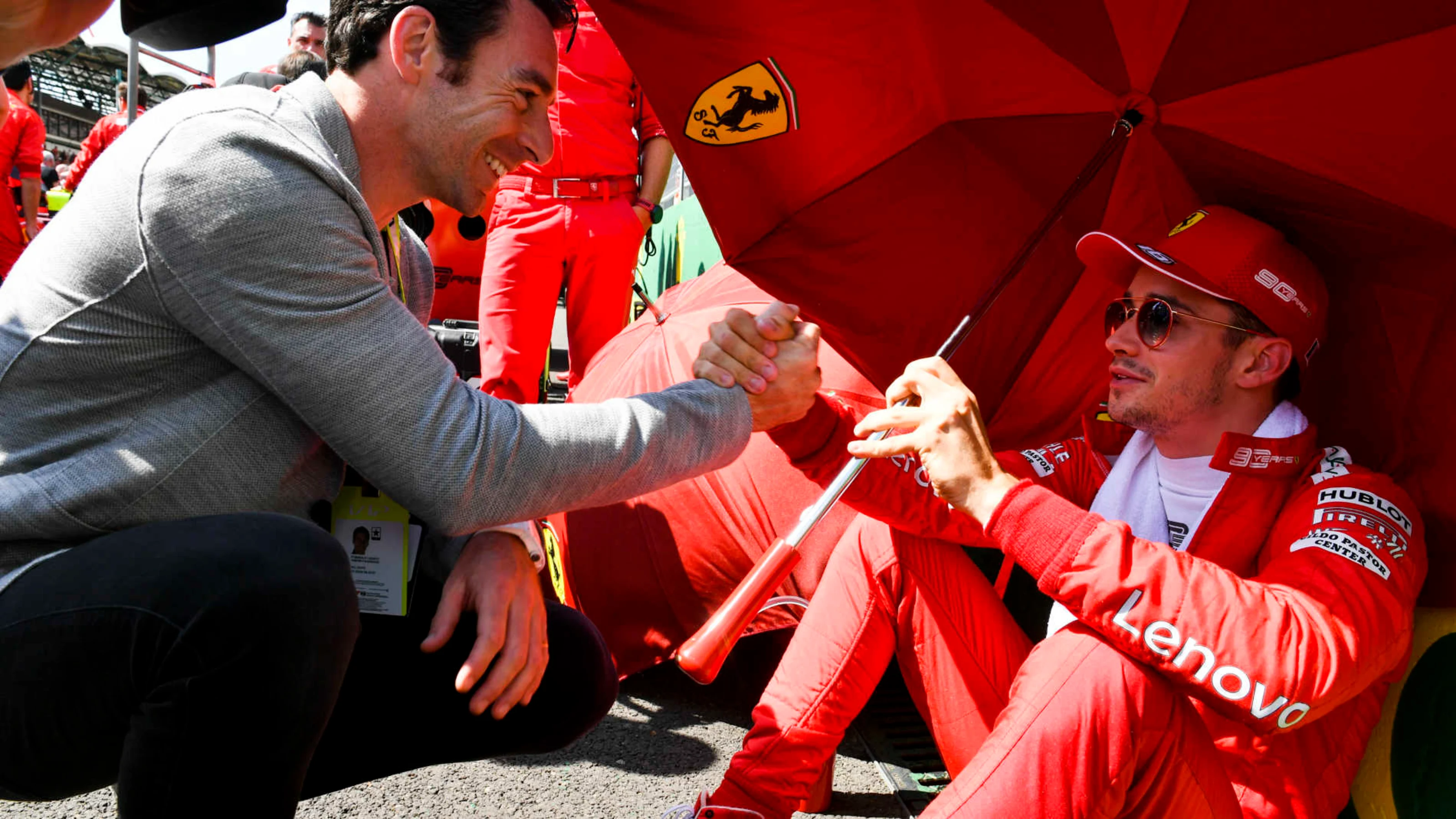 HUNGARORING, HUNGARY - AUGUST 04: Indy 500 winner Simon Pagenaud talks to Charles Leclerc, Ferrari