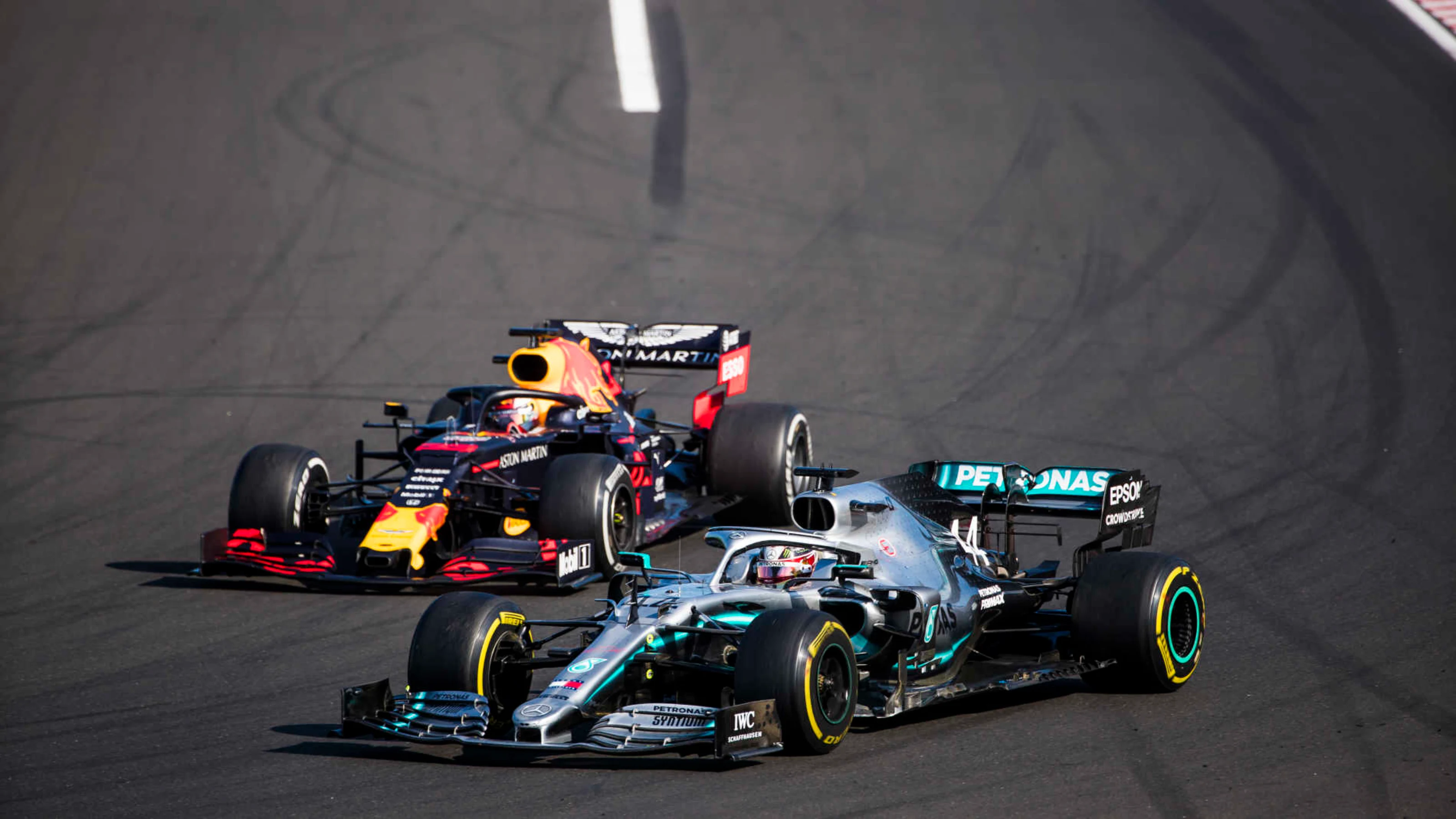 HUNGARORING, HUNGARY - AUGUST 04: Lewis Hamilton, Mercedes AMG F1 W10, passes Max Verstappen, Red