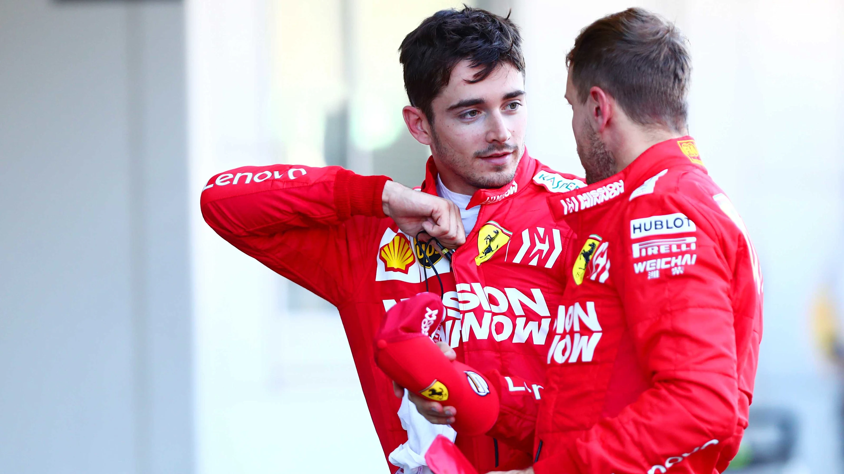 SUZUKA, JAPAN - OCTOBER 13: Charles Leclerc of Monaco and Ferrari talks with second placed