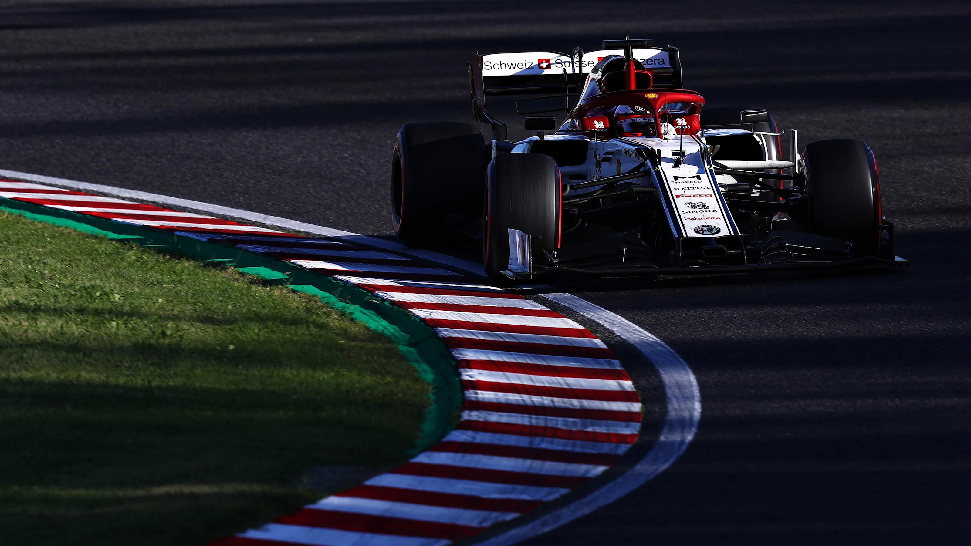 SUZUKA, JAPAN - OCTOBER 13: Kimi Raikkonen of Finland driving the (7) Alfa Romeo Racing C38 Ferrari