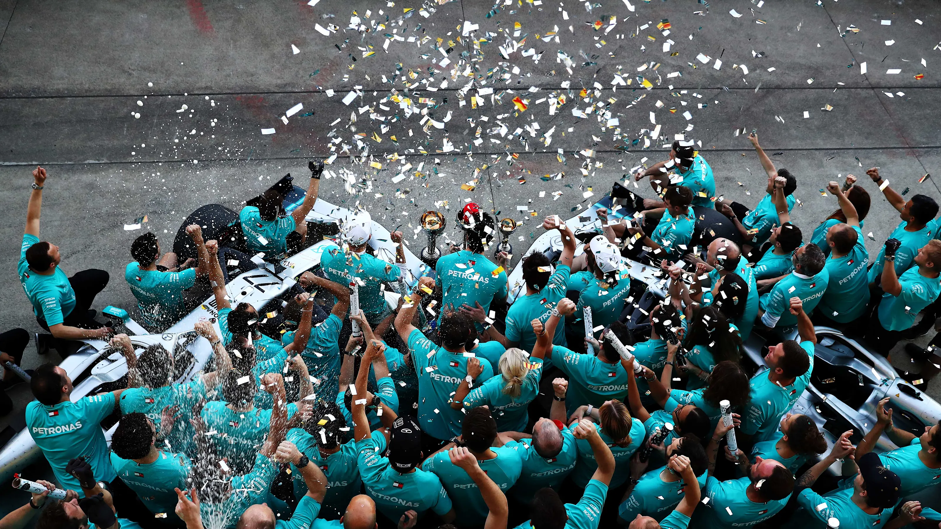 SUZUKA, JAPAN - OCTOBER 13: The Mercedes GP team celebrate winning the constructors championship
