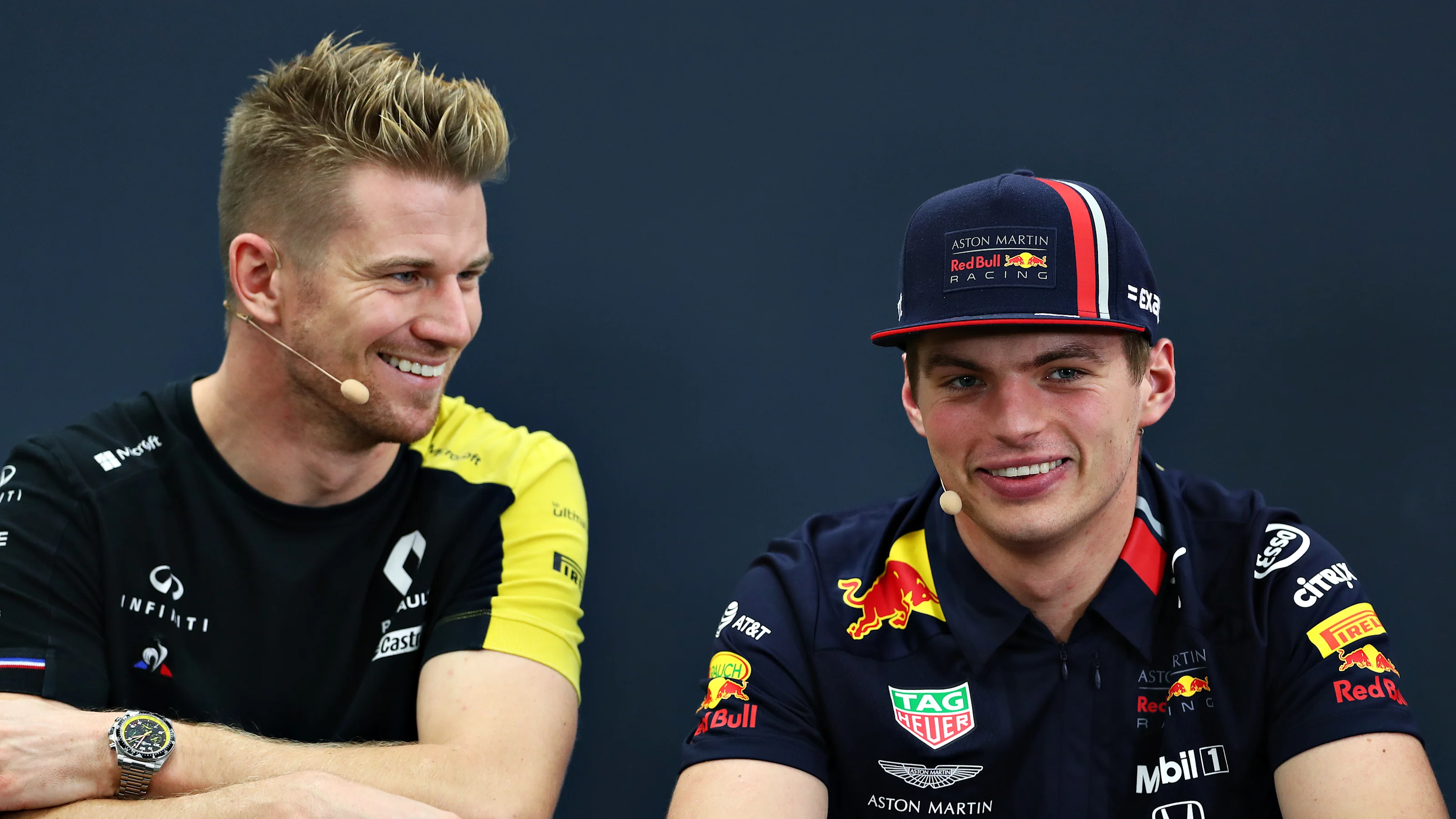 SUZUKA, JAPAN - OCTOBER 10: Nico Hulkenberg of Germany and Renault Sport F1 and Max Verstappen of