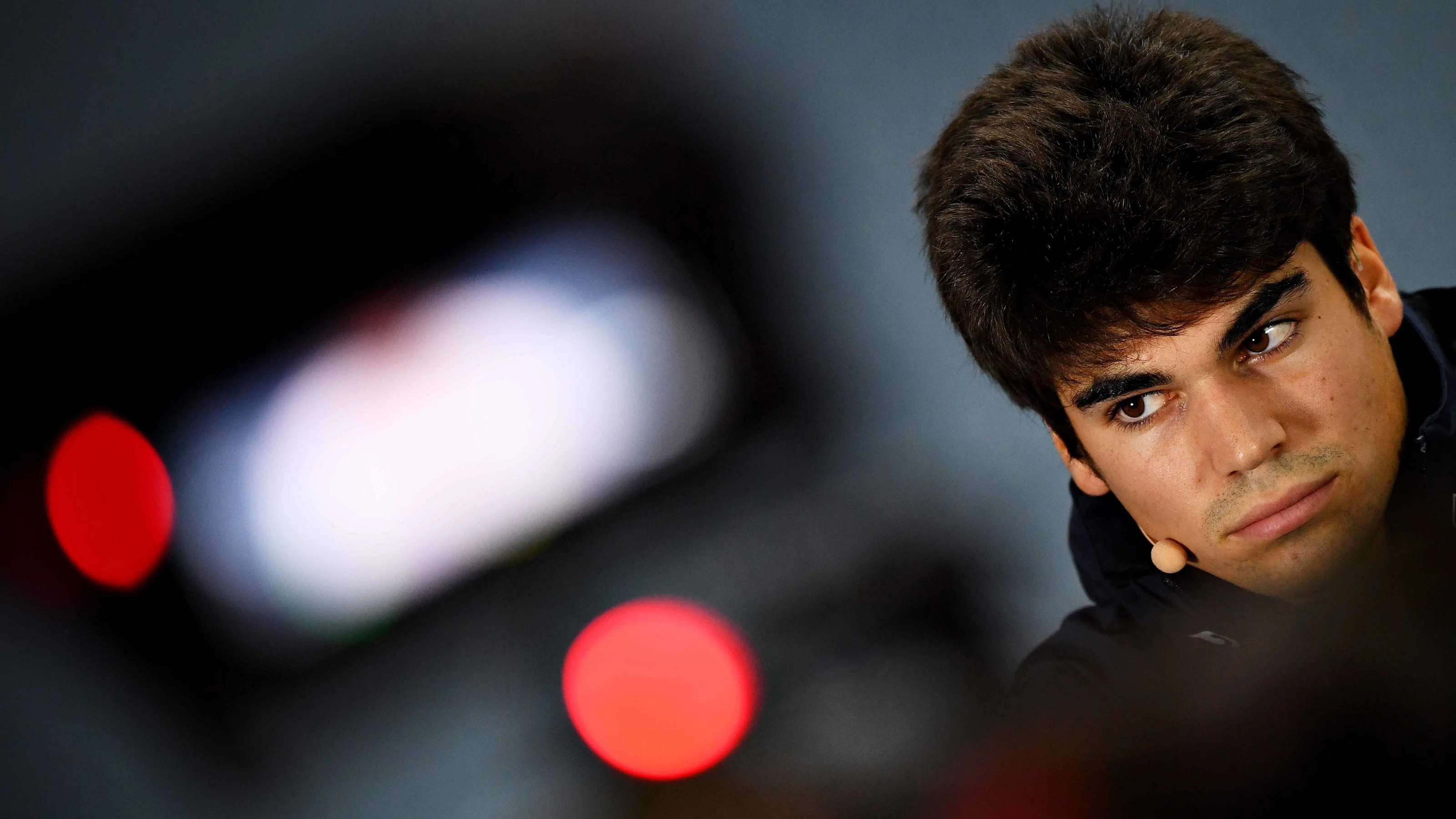 SOCHI, RUSSIA - SEPTEMBER 26: Lance Stroll of Canada and Racing Point looks on in the Drivers Press